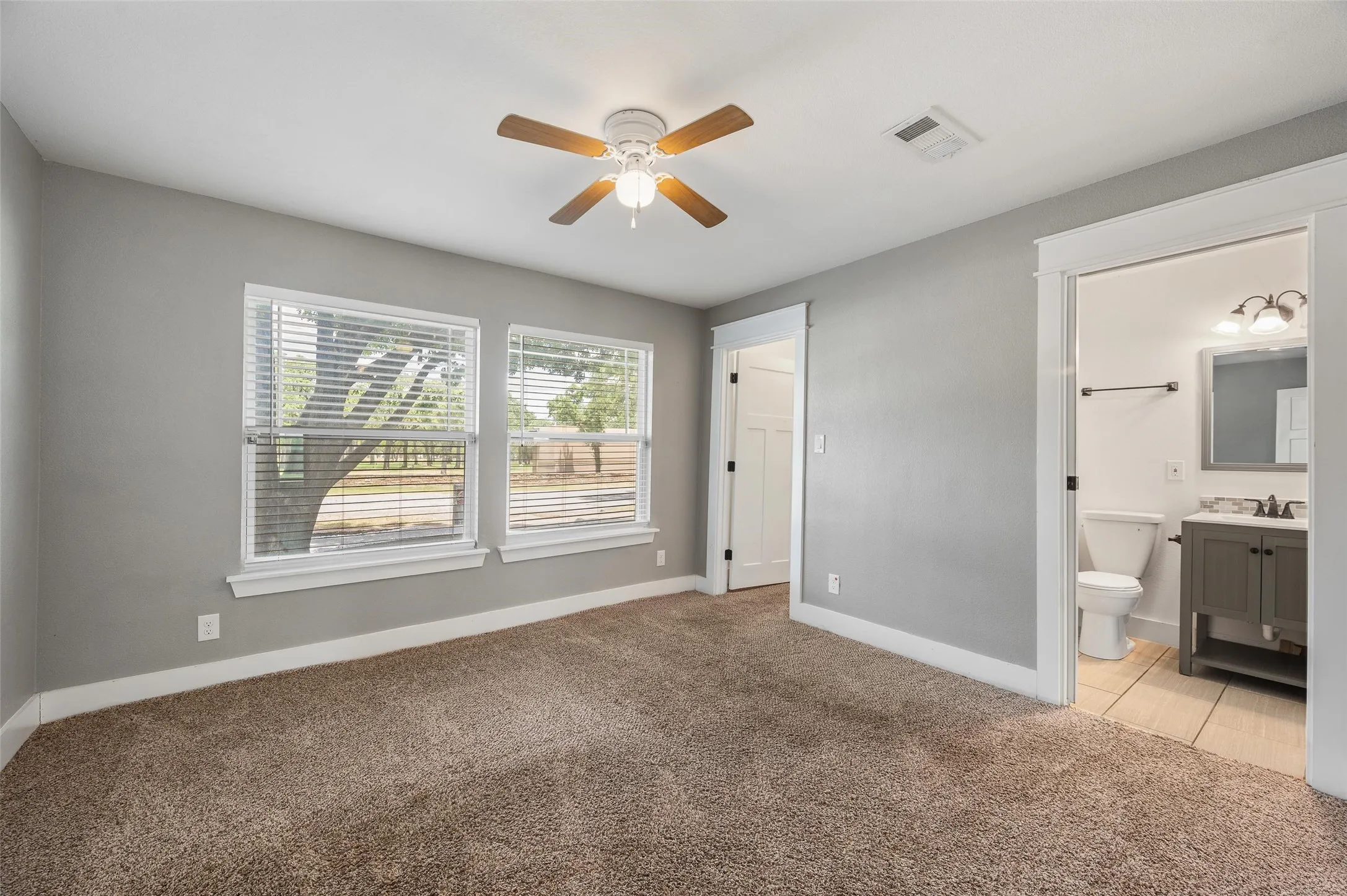 Front bedroom with walk in closet and access to jack and Jill bath