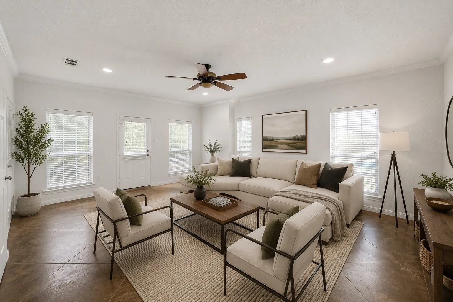 This picture has been virtually staged. Spacious living area featuring light-toned walls and crown molding