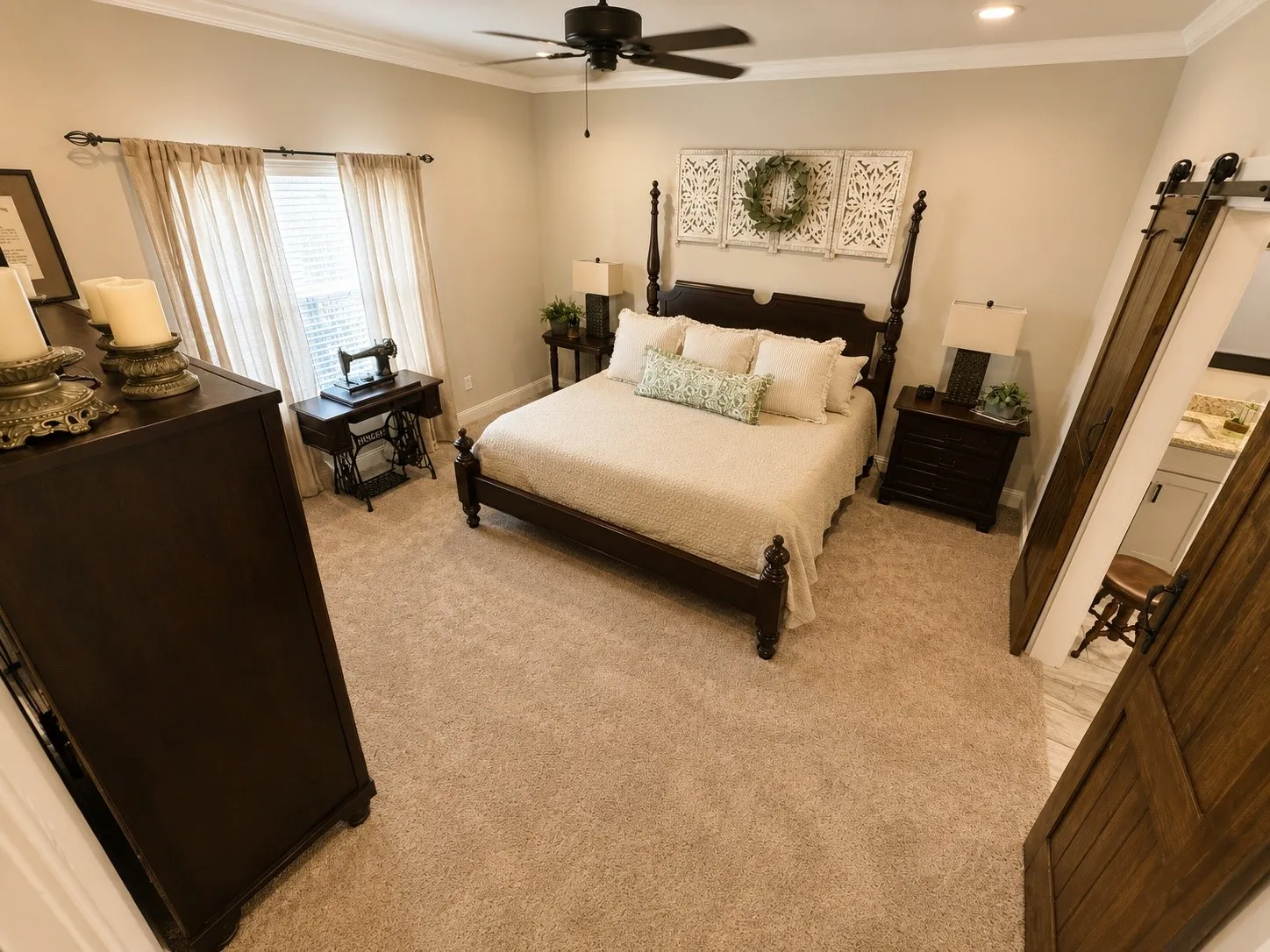 Carpeted bedroom with crown molding, a ceiling fan, recessed lighting, and a barn door entry to an adjacent space