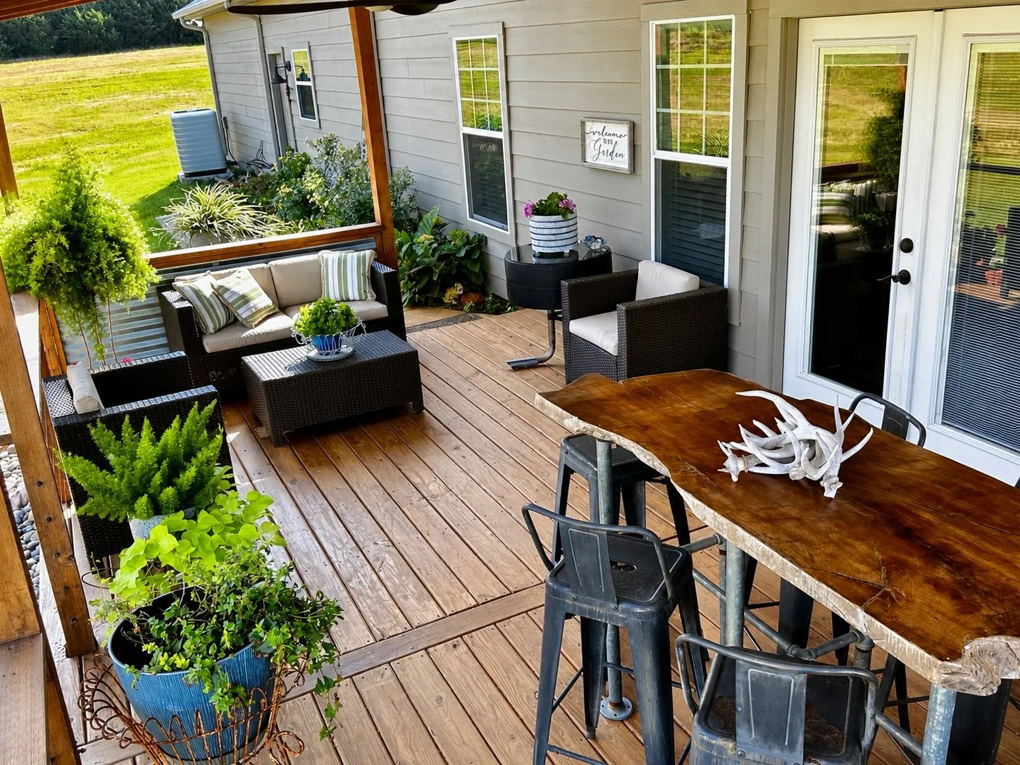 Expansive outdoor deck featuring wood flooring and a covered area