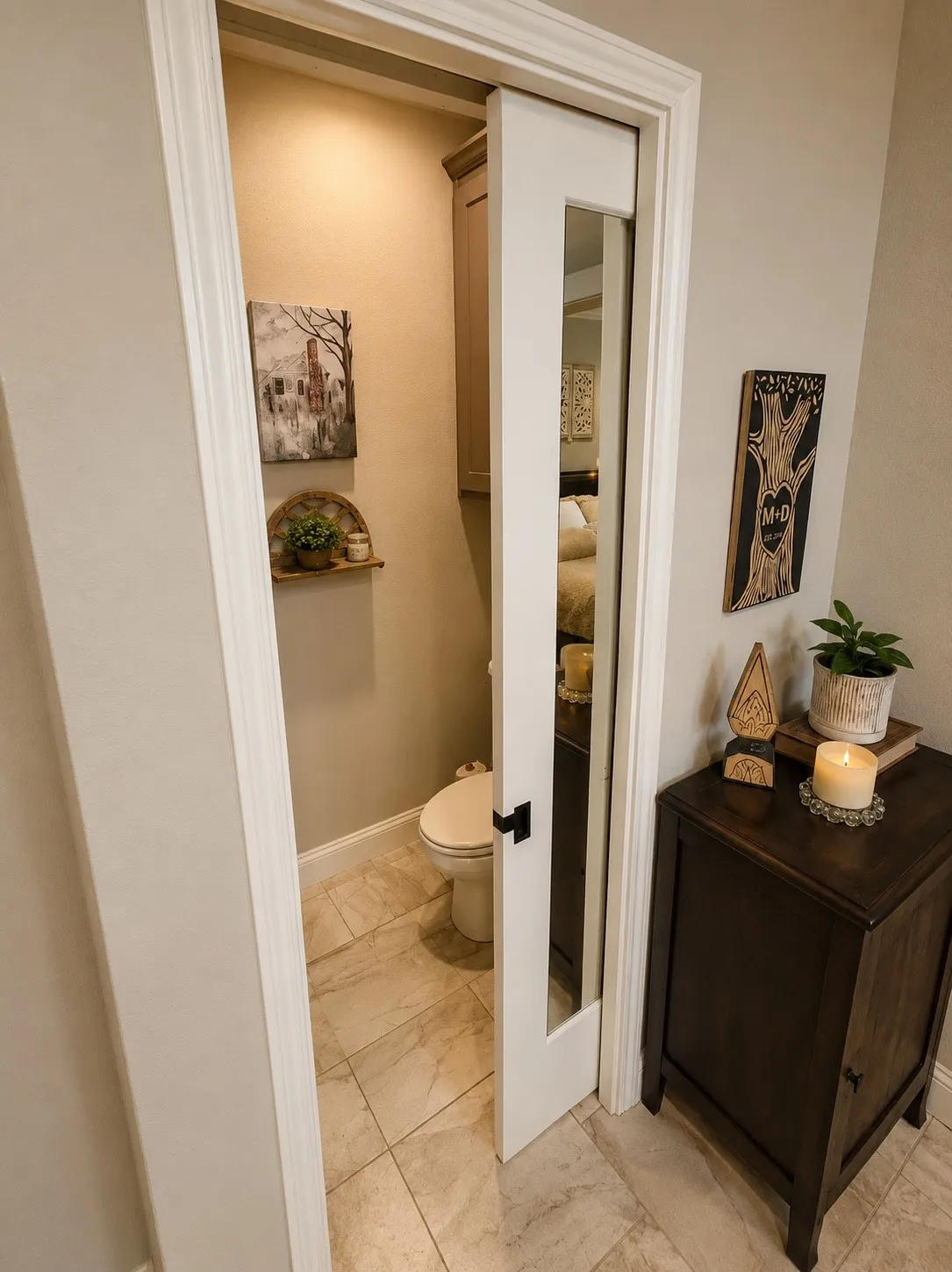 Recessed water closet with tiled flooring, white baseboards, and a built-in upper cabinet