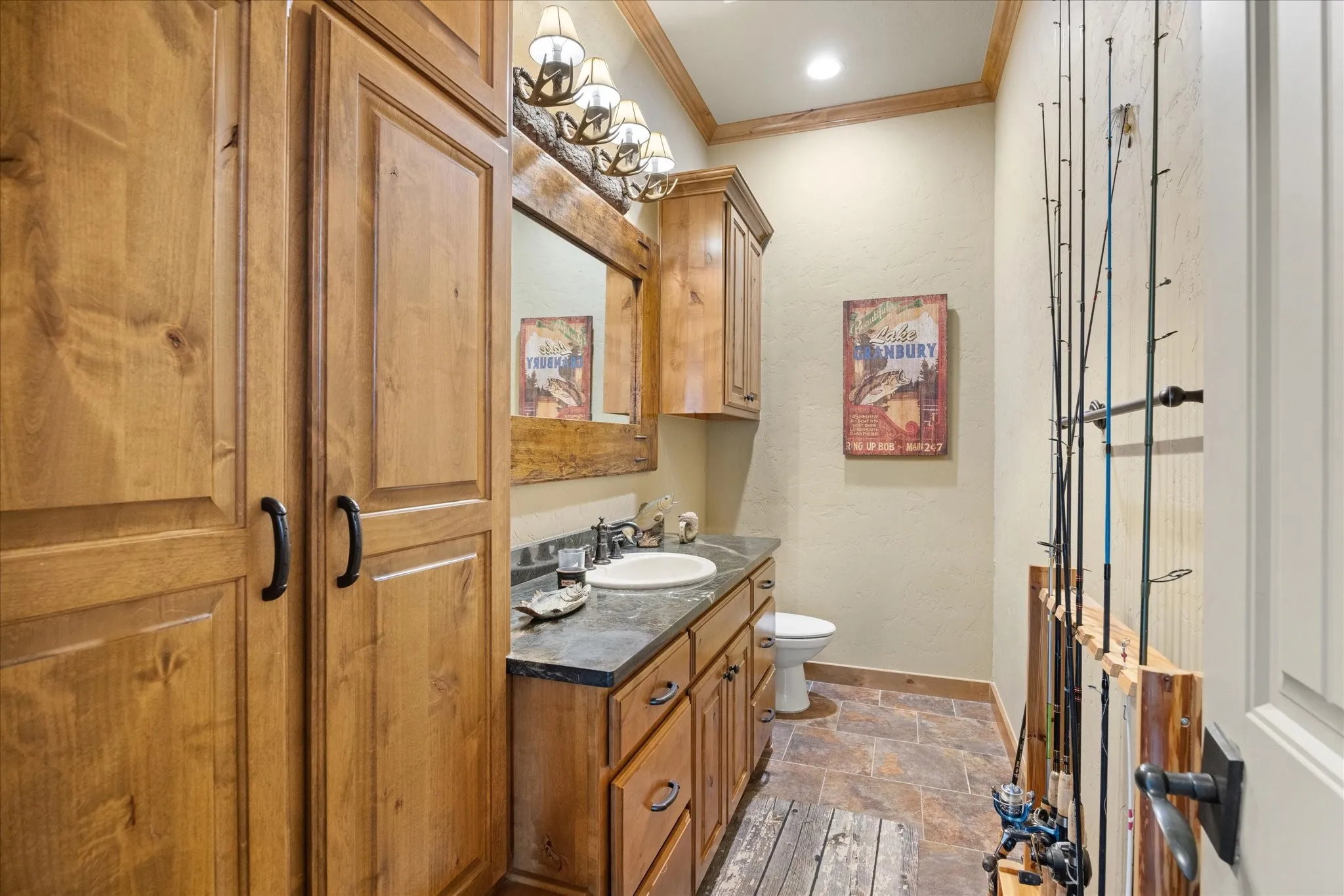 Full-height wood cabinetry featuring black hardware