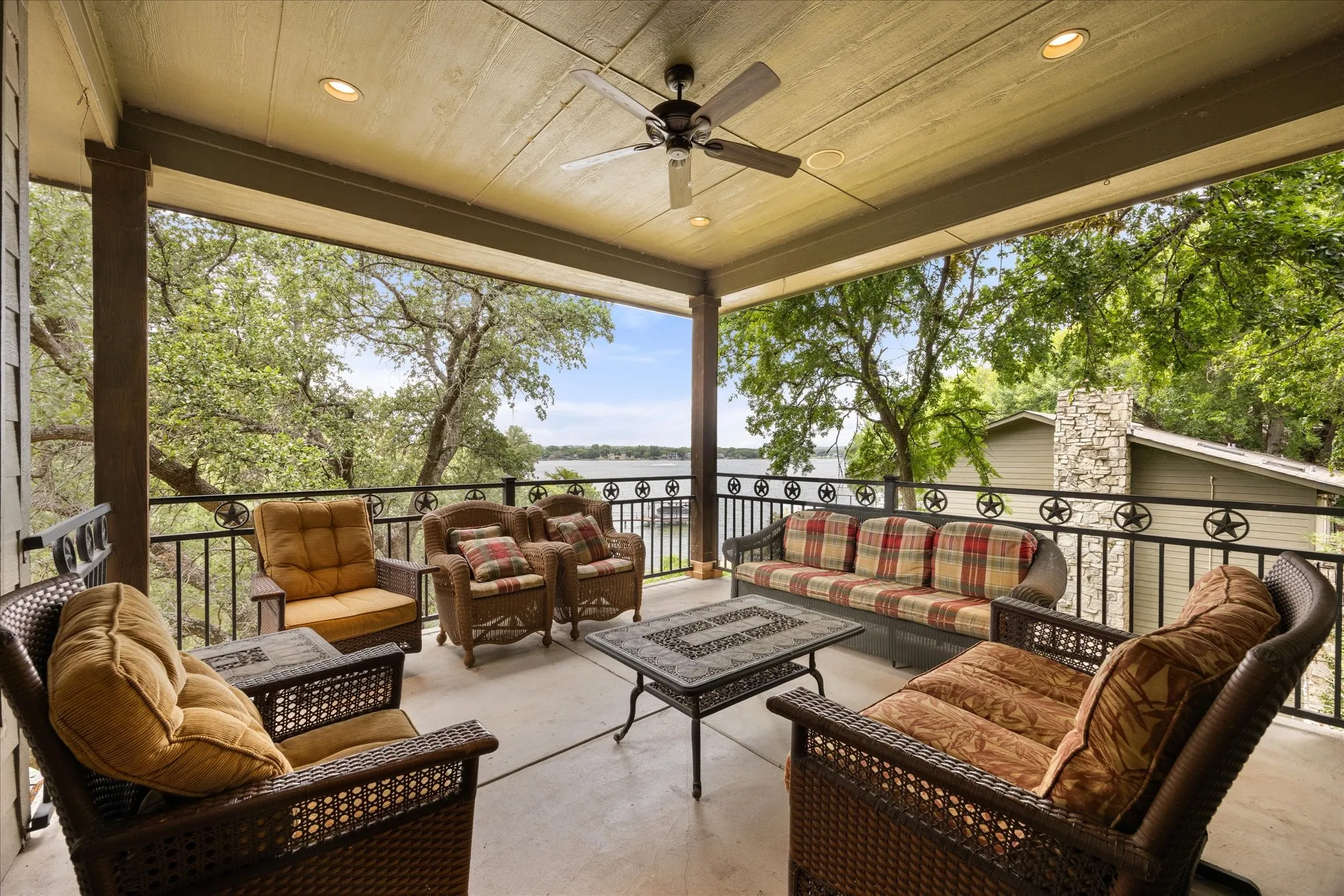 Covered outdoor patio featuring a concrete surface and a wood-finish ceiling