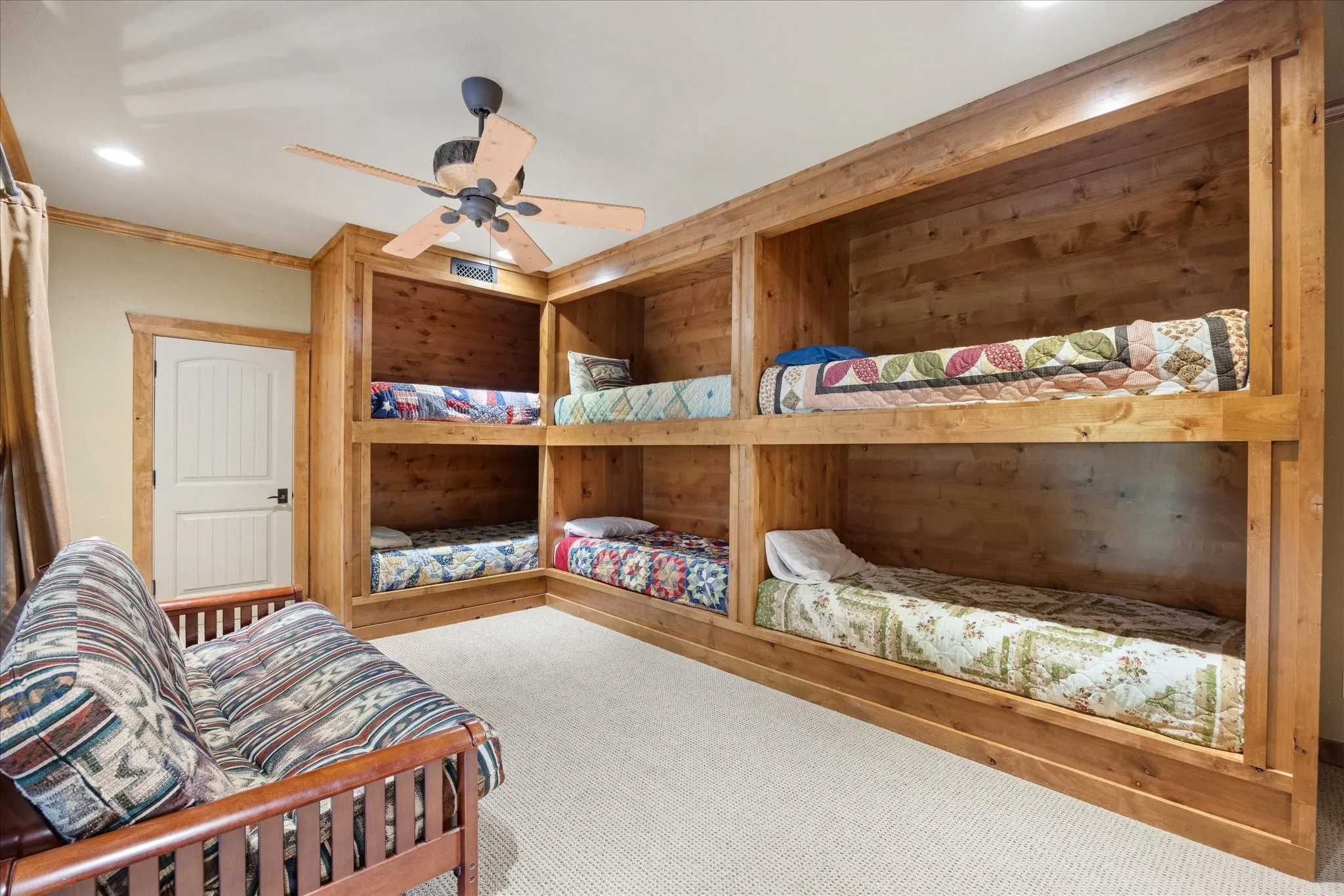 Room featuring built-in wood bunk beds, recessed lighting, and a ceiling fan