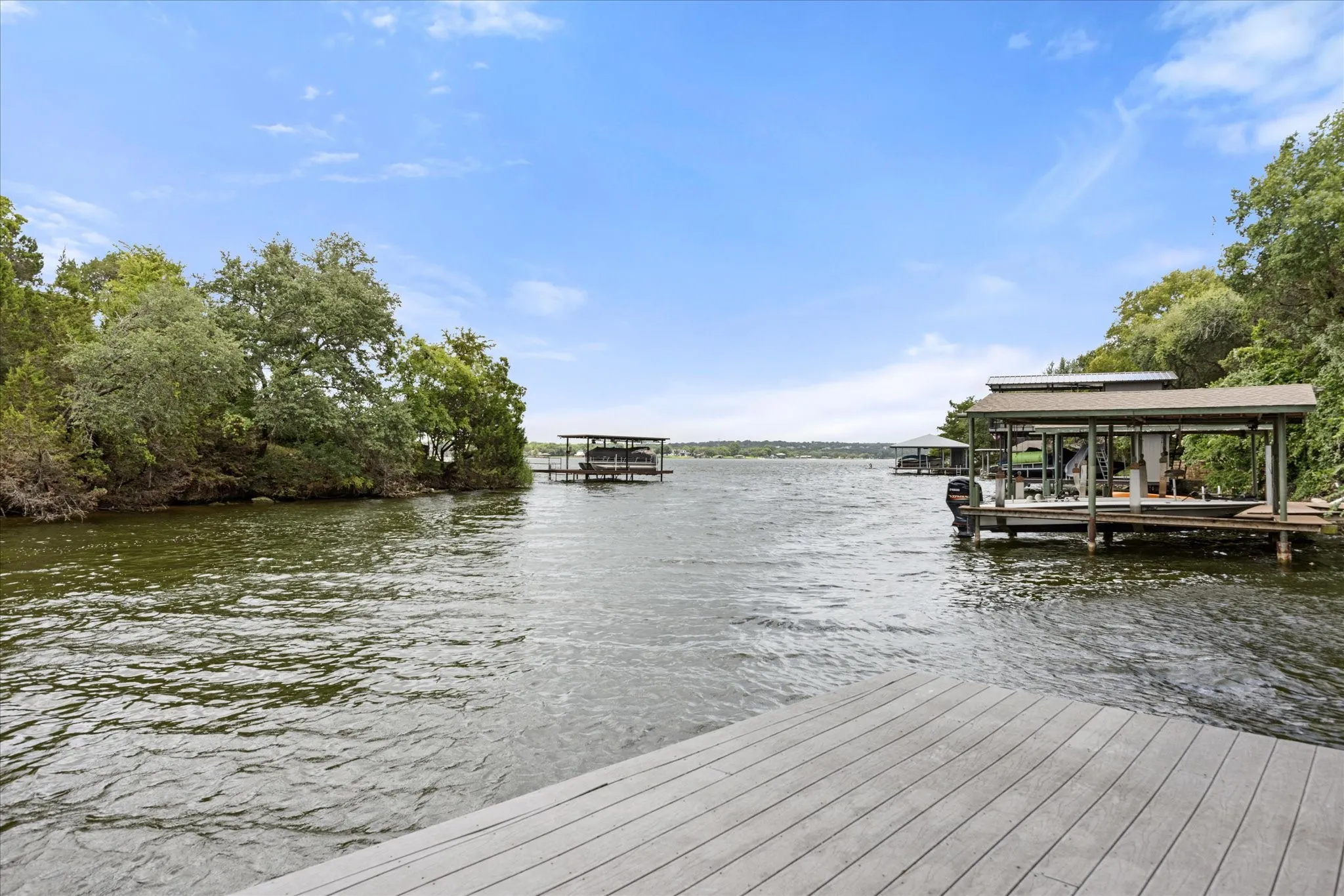 Waterfront property featuring a private boat dock and covered boat slip