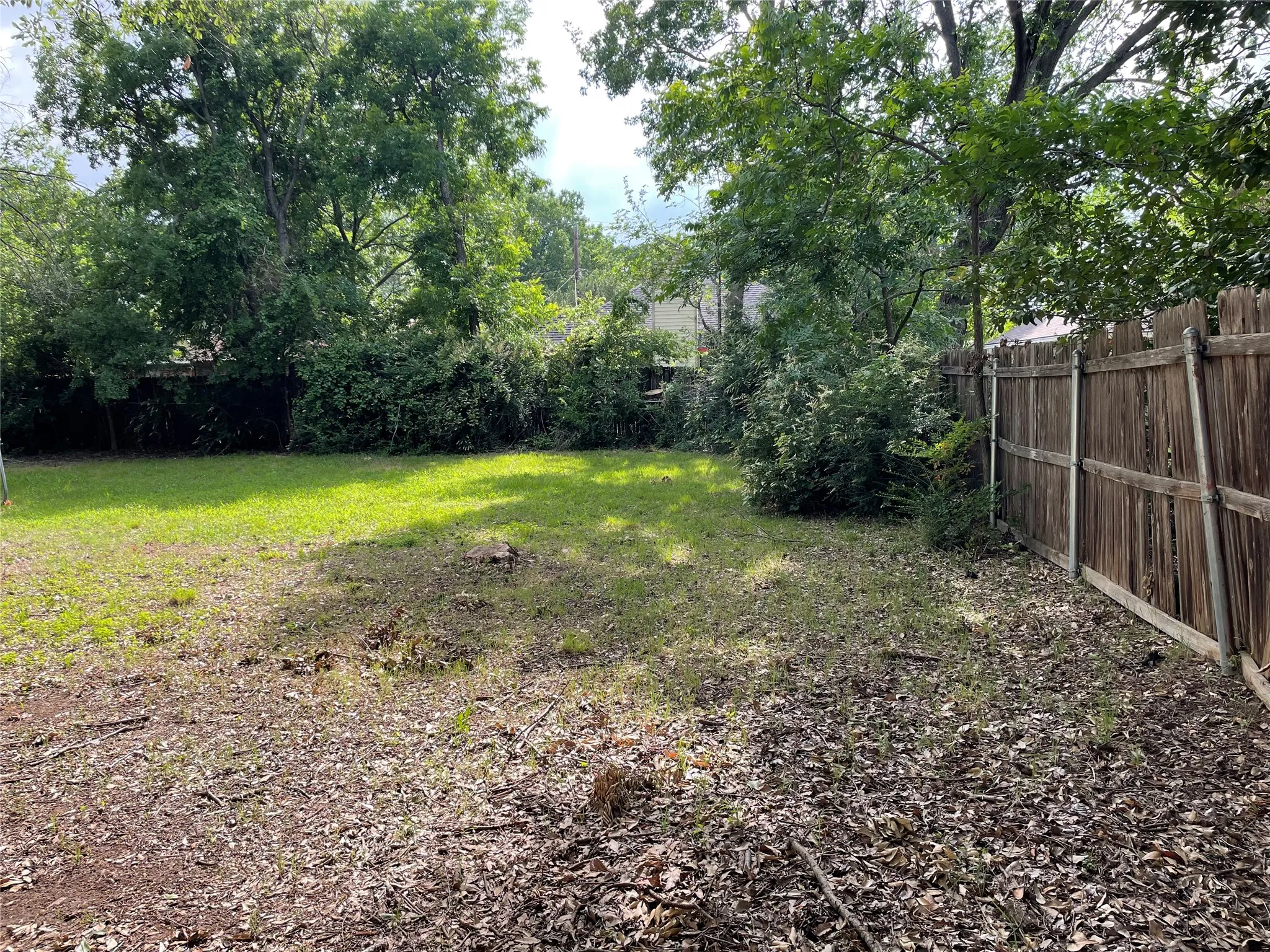 View of fenced backyard