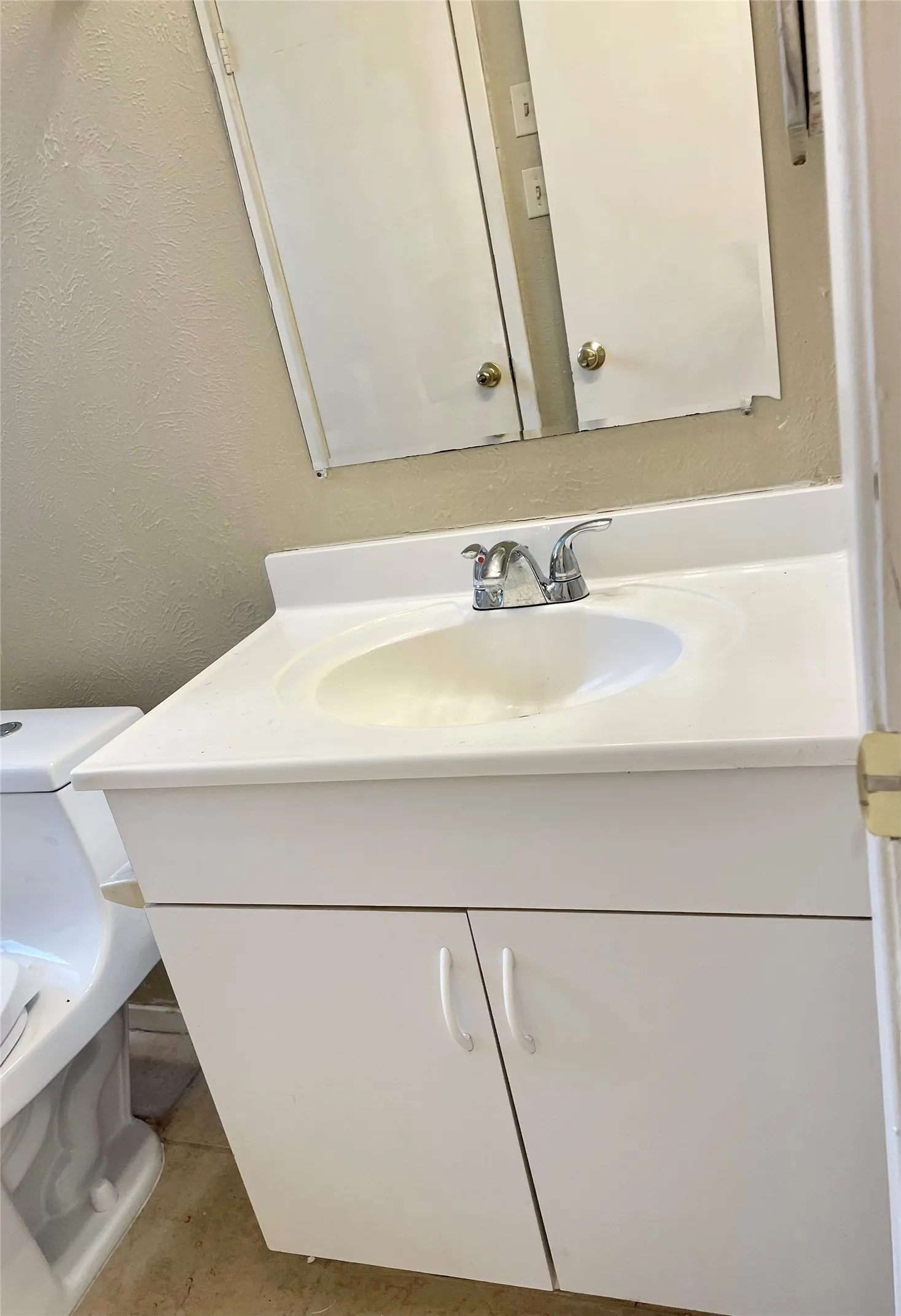 Bathroom featuring vanity and tile patterned floors