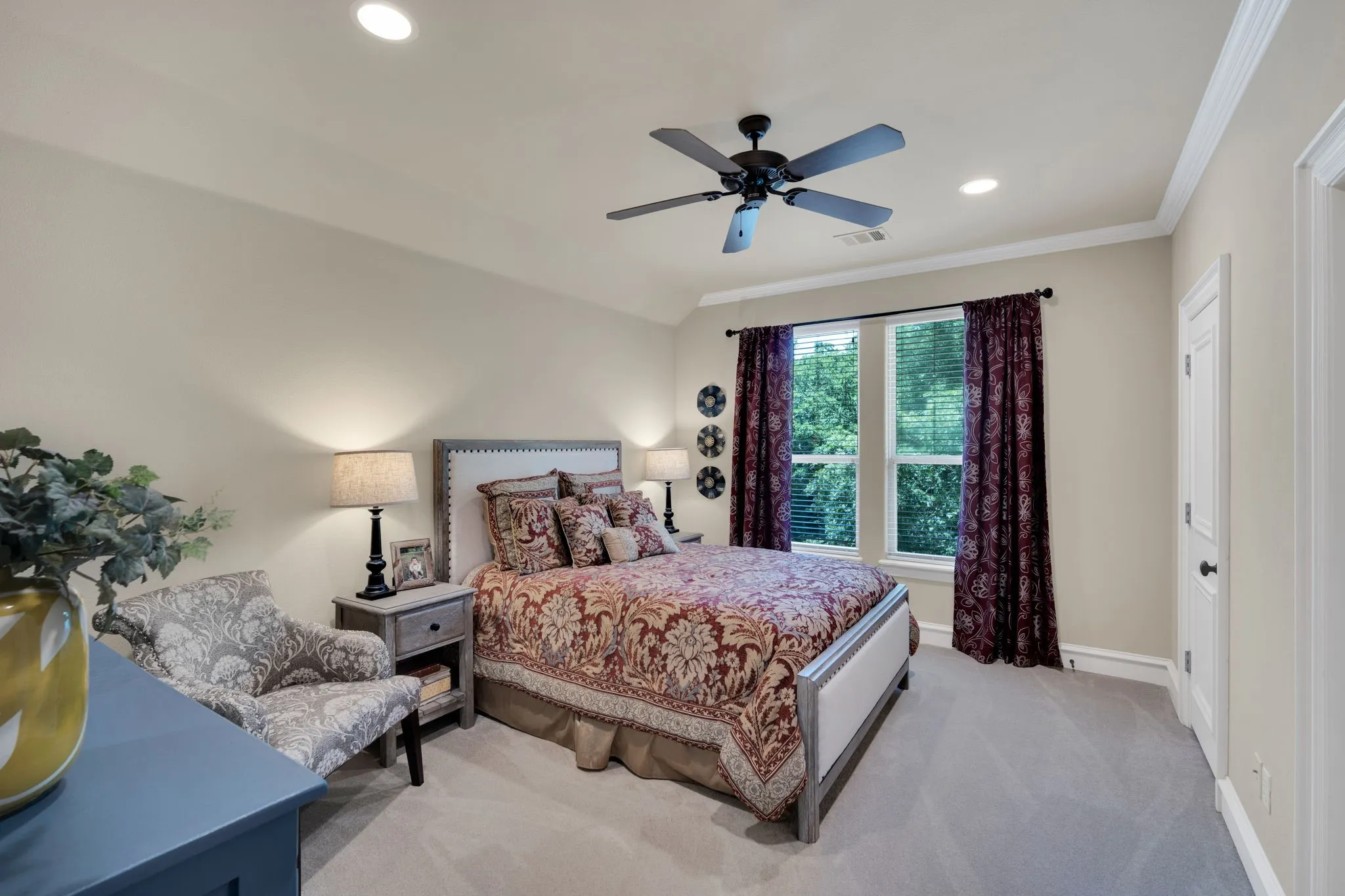 Carpeted room featuring a ceiling fan with light, recessed lighting, and crown molding