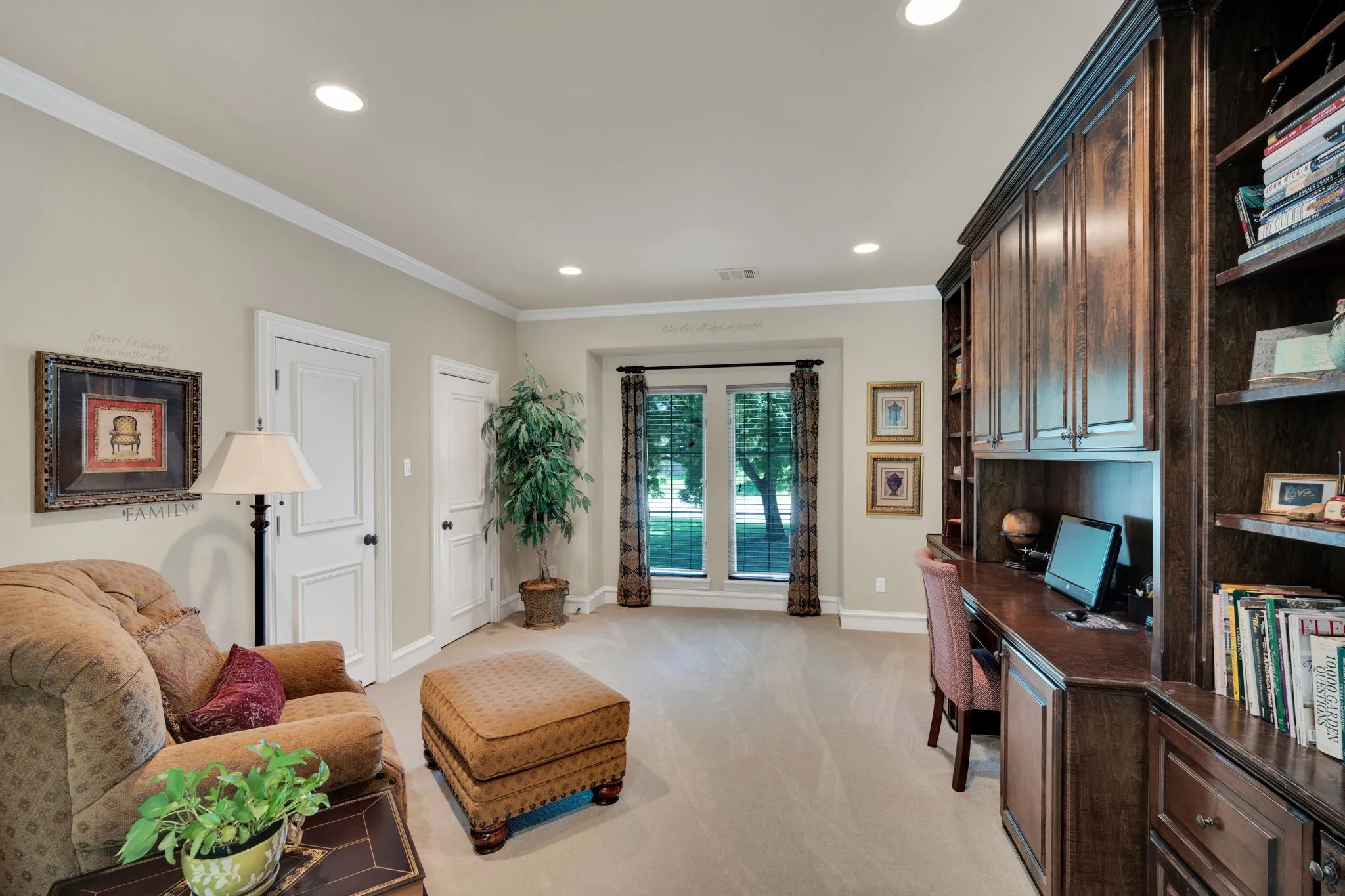 Built-in dark wood cabinetry with open shelving and an integrated desk area