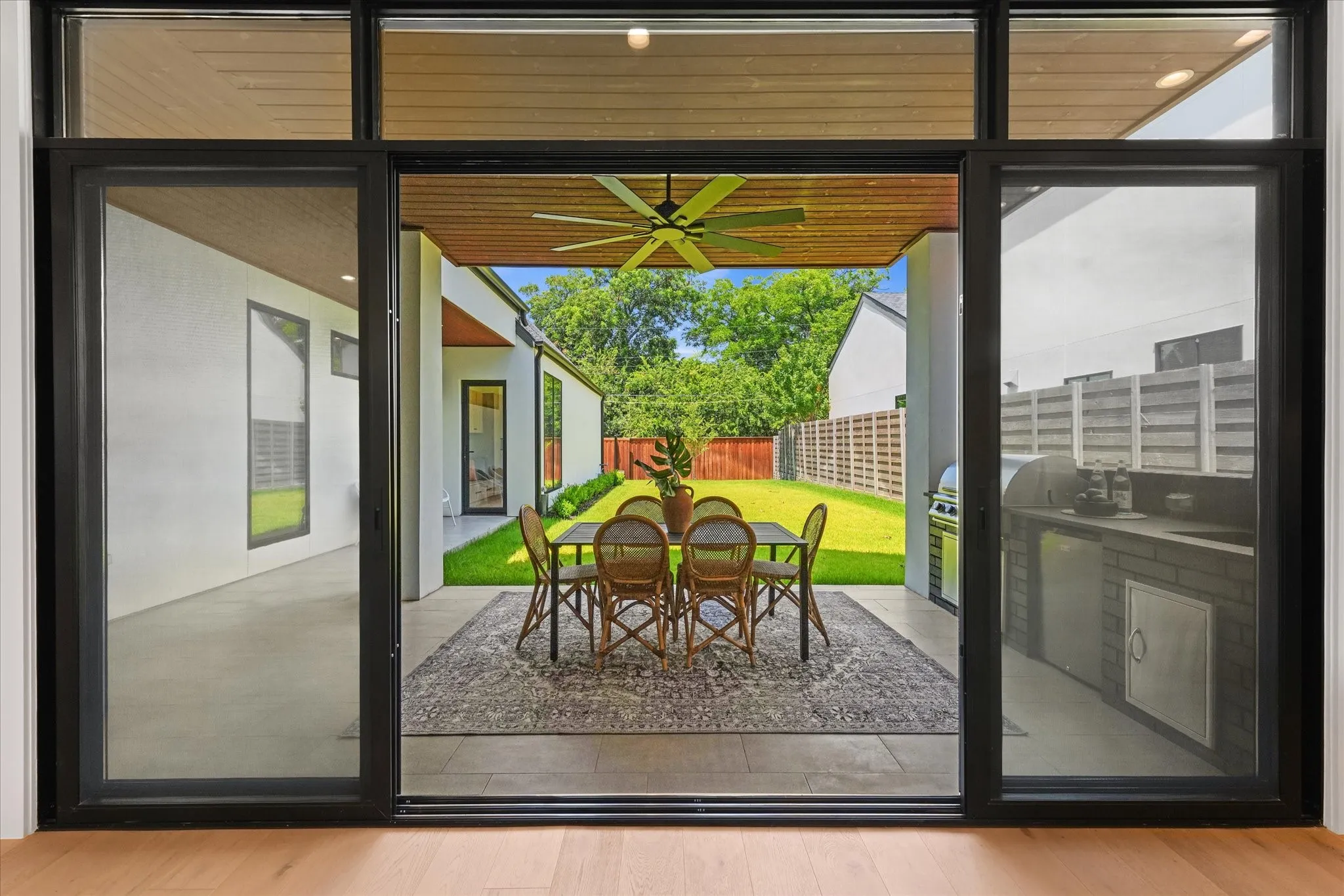 Sliding glass doors open out outdoor living