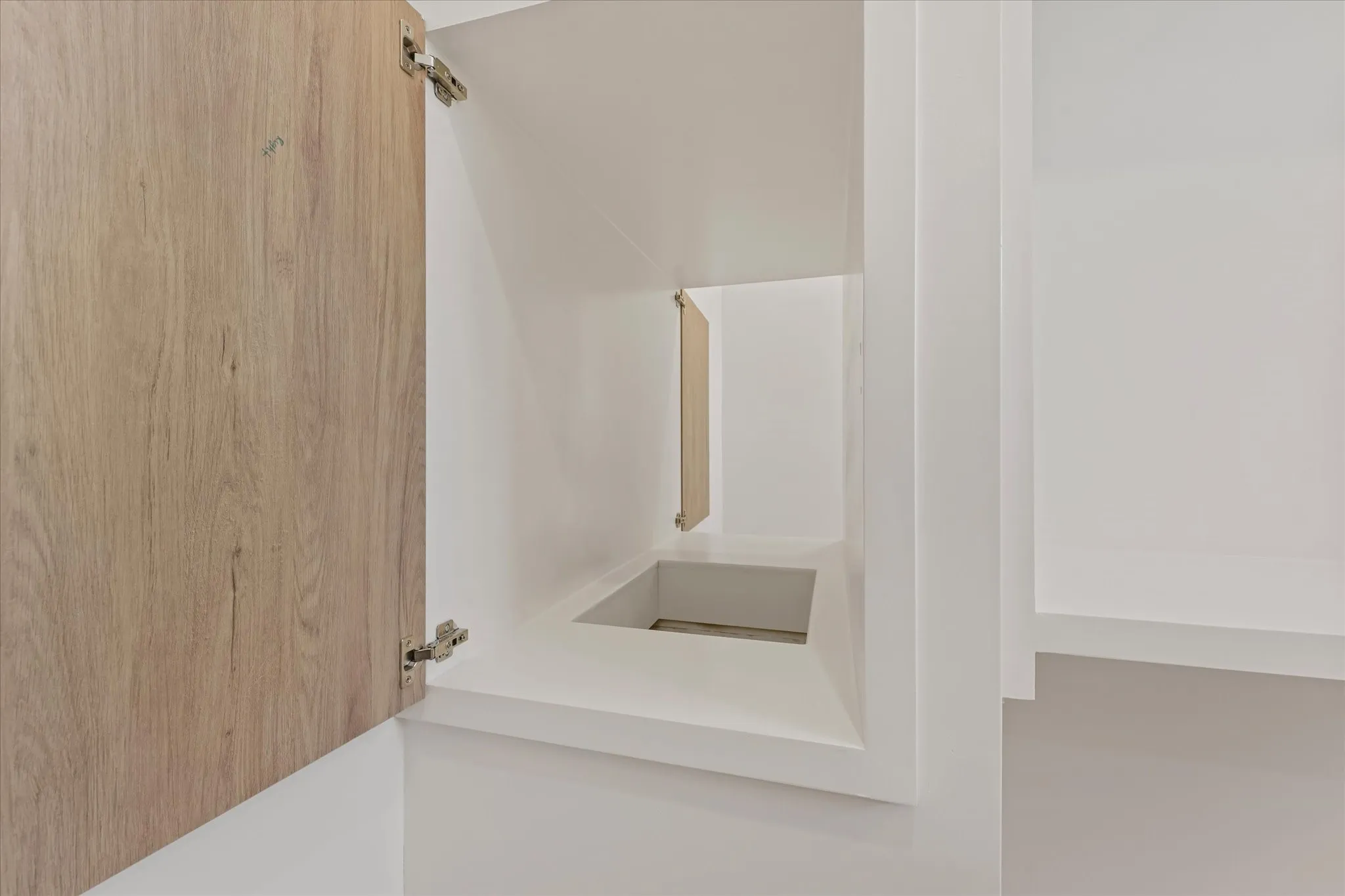 Laundry shoot in both 2nd story bedroom closets