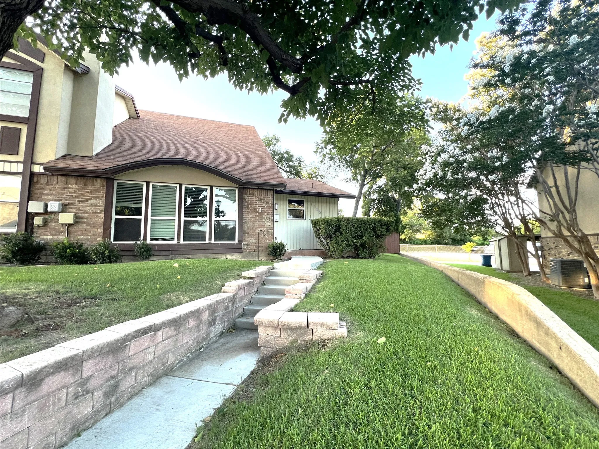 Fron of the house showing large side yard