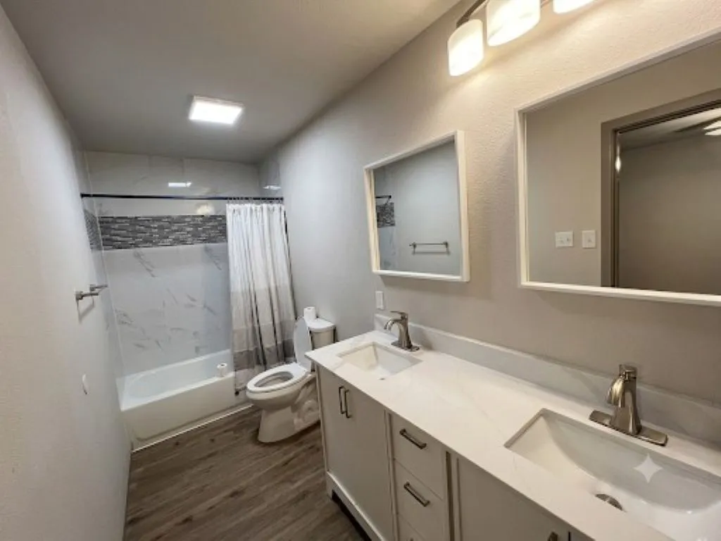 Double sinks in this updated master bathroom on the first floor
