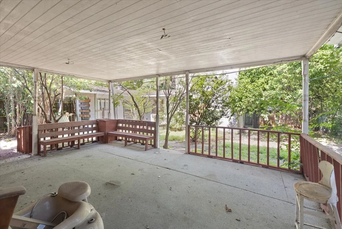 Covered patio featuring concrete flooring and a white paneled ceiling