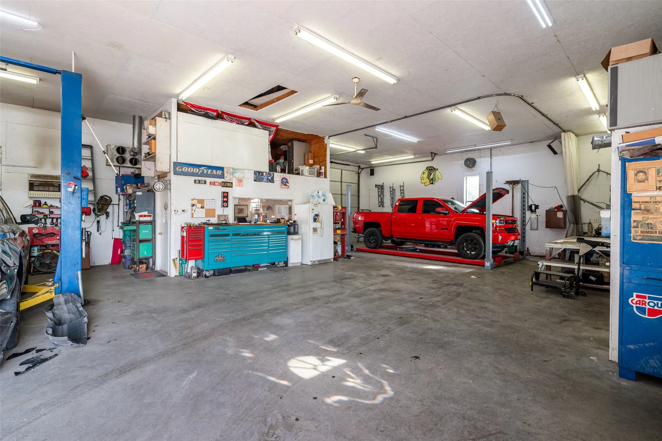 Garage with a workshop area and office.