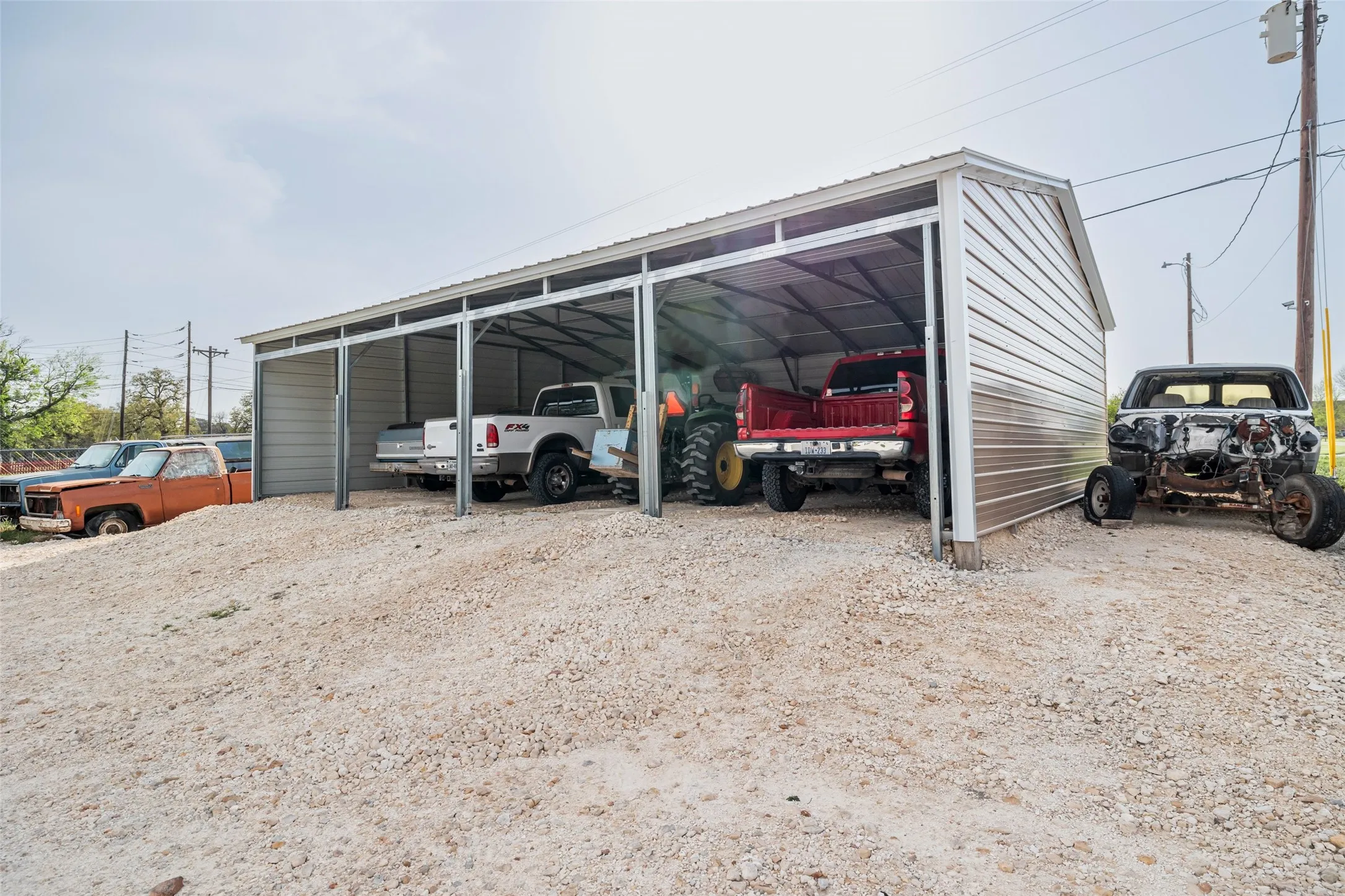 Carport measures 30 X 40. A newly constructed carport has been added to the property, offering additional storage space for supplies or extra vehicles. Built in 2006.
