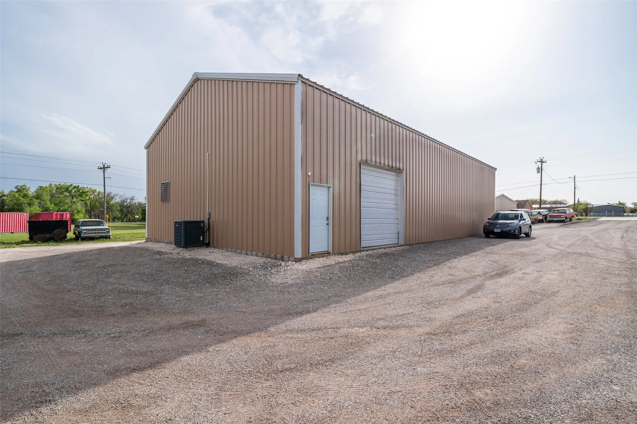 View of 40 X 70 building with 12 X 12 one 10 x 10 overhead door - heated and air conditioned with upstairs office and bathroom. Built in 2016.