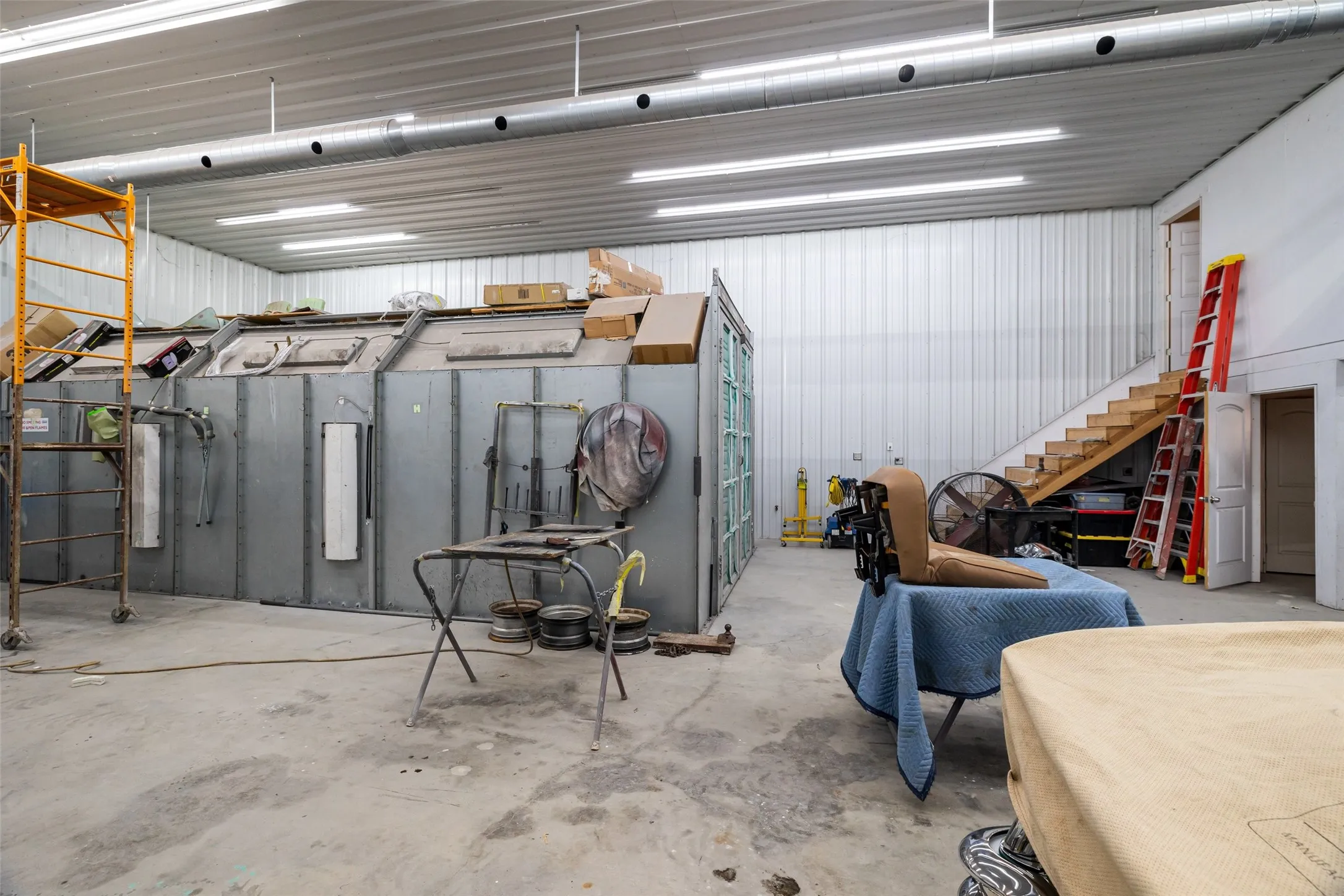 Paint booth and stairs to office.