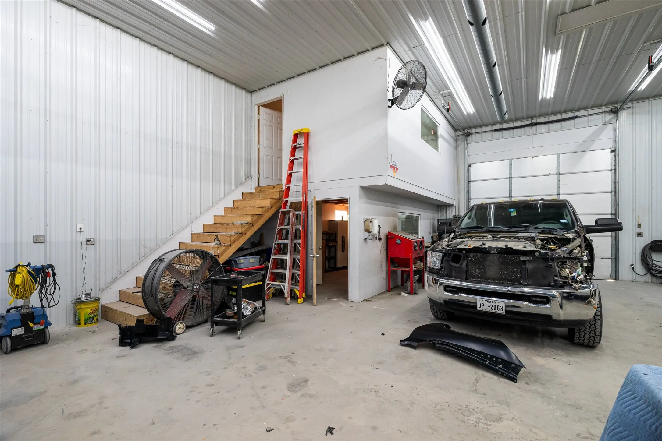 40 x 70 Garage with 12 X 12 overhead door. Heated and air-conditioned office upstairs with restroom.