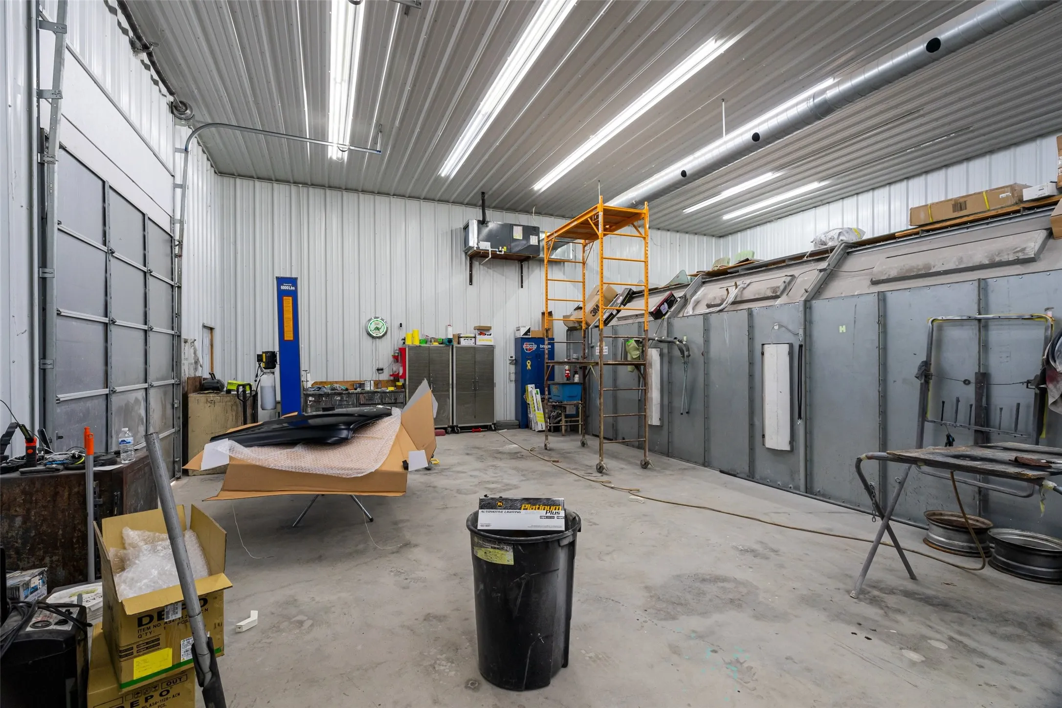 40 x 70 building showing overhead door and paint booth.