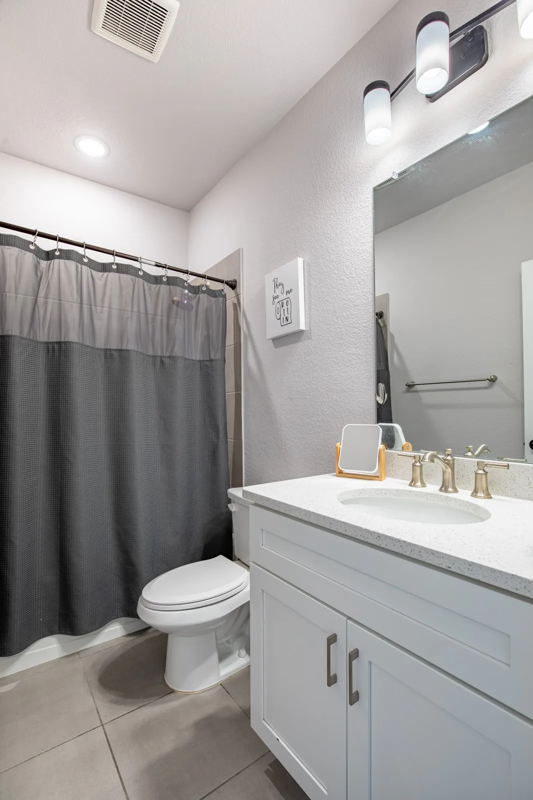Full bath with tub/shower combo.
