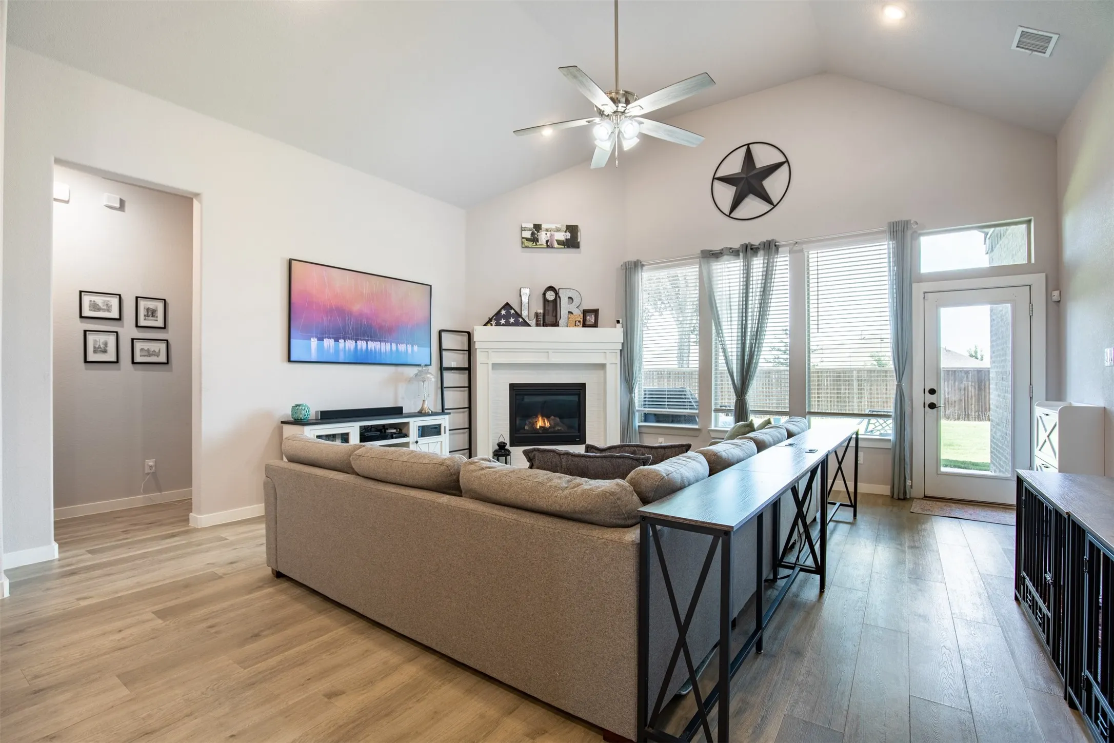 Spacious living room with vaulted ceiling.