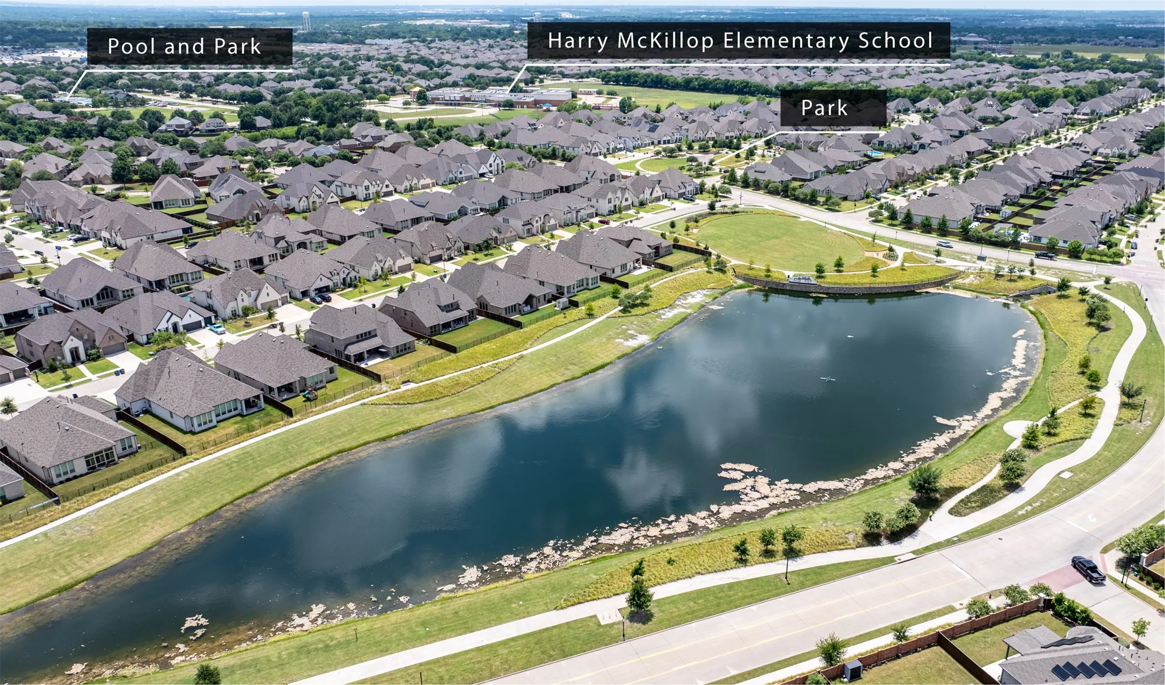 Aerial view of lake and surrounding areas.