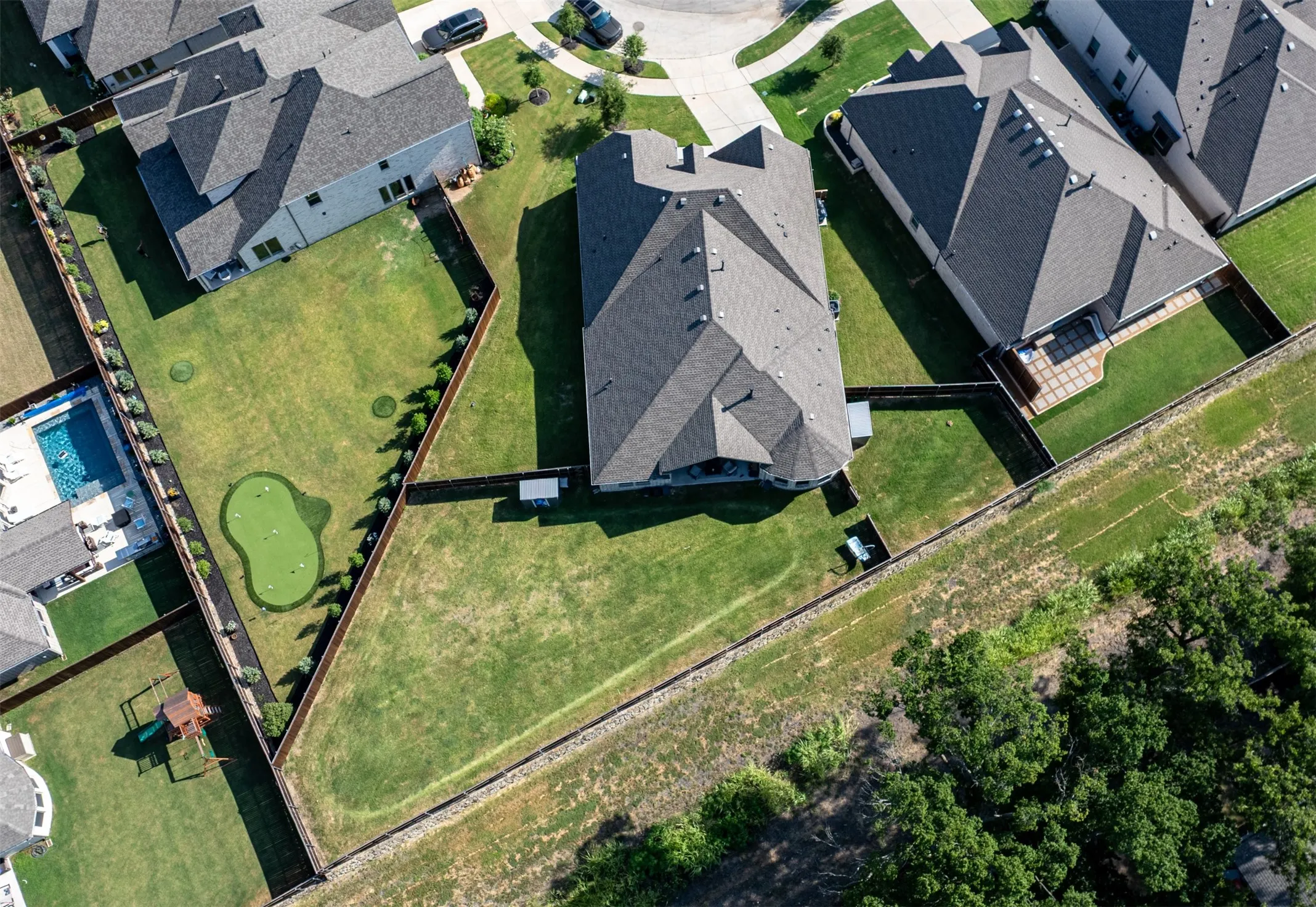 Aerial view of home showcasing backyard.