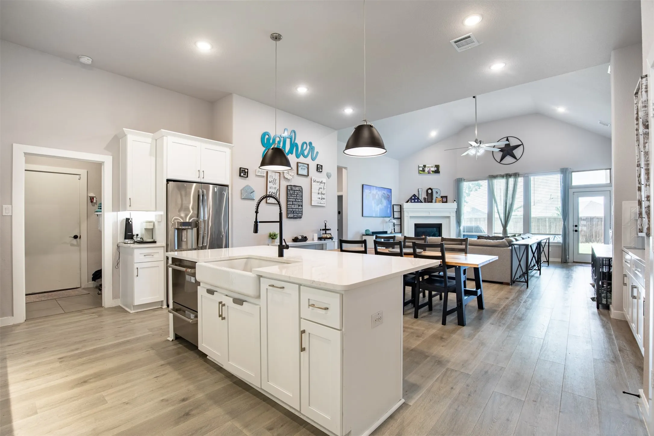 Kitchen flows seamlessly into dining and living room.