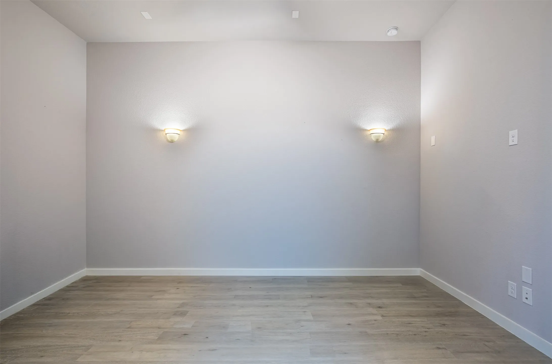 Media room with sconce lighting.