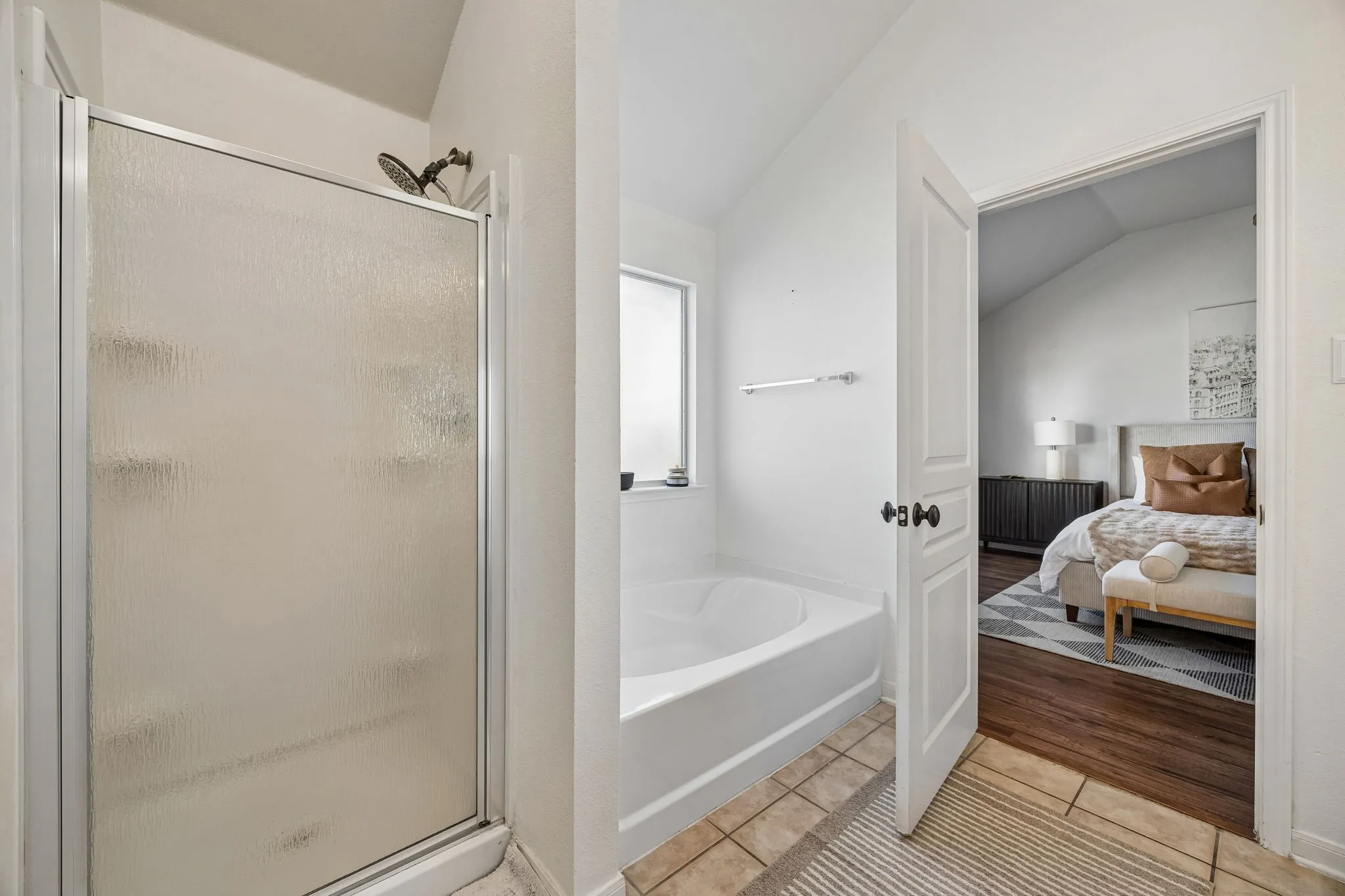 Private ensuite bath boasts separate shower and tub.