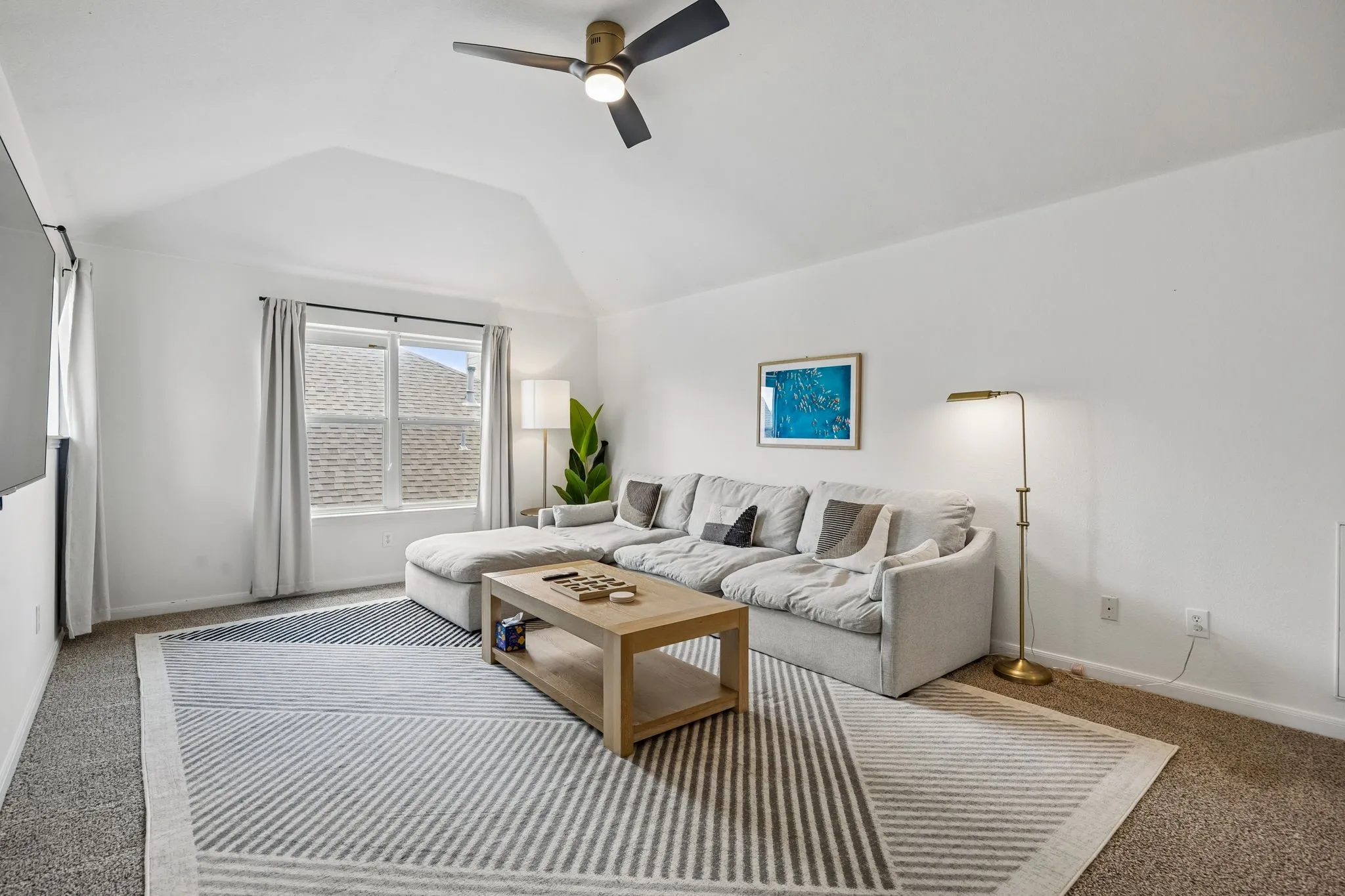 Upstairs, you’ll find a large second living area that includes a convenient half bath, providing a flexible space that works beautifully as a media room, office or play area.
