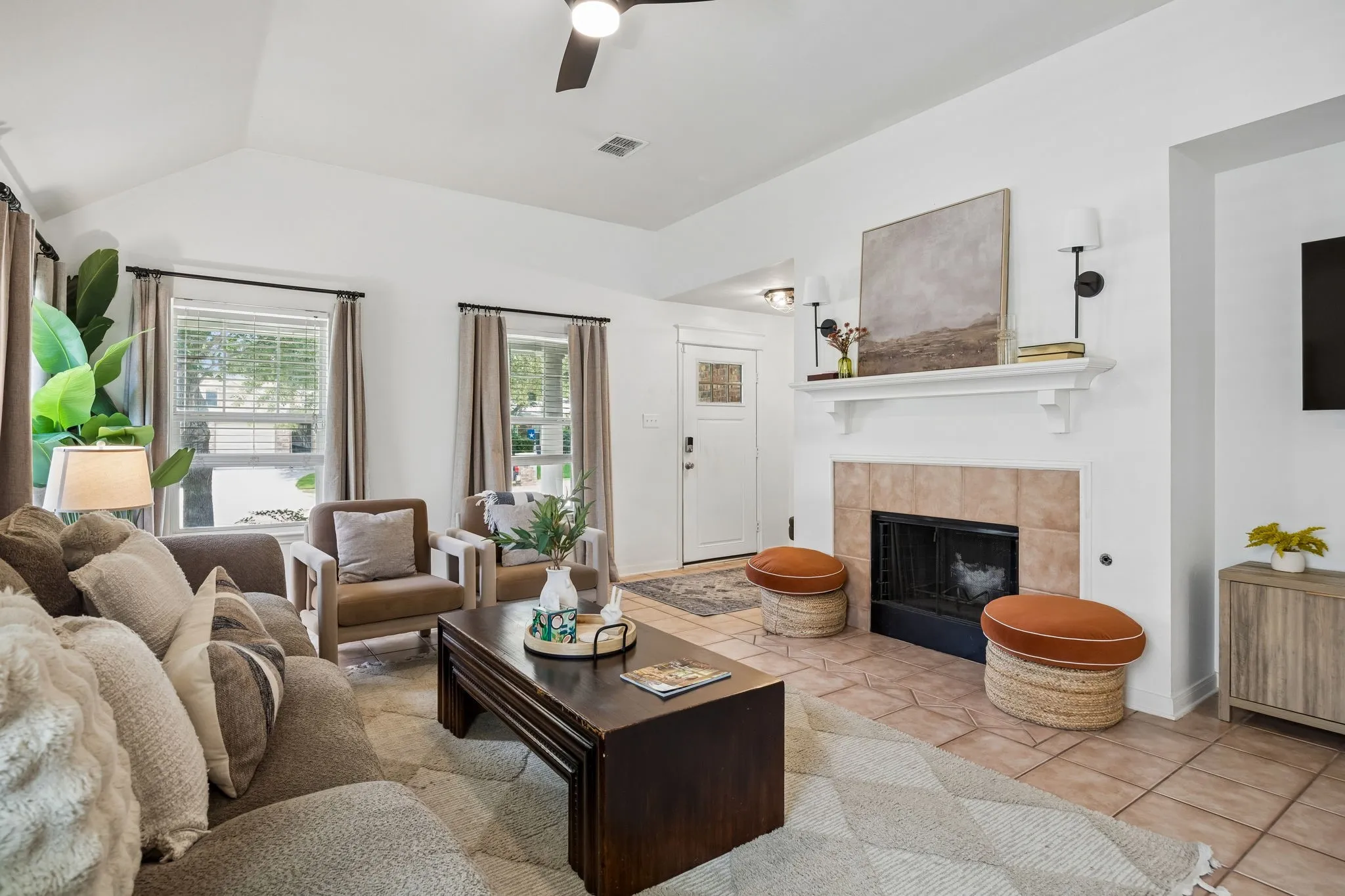 The living room is centered around a cozy gas fireplace—ideal for relaxing evenings.