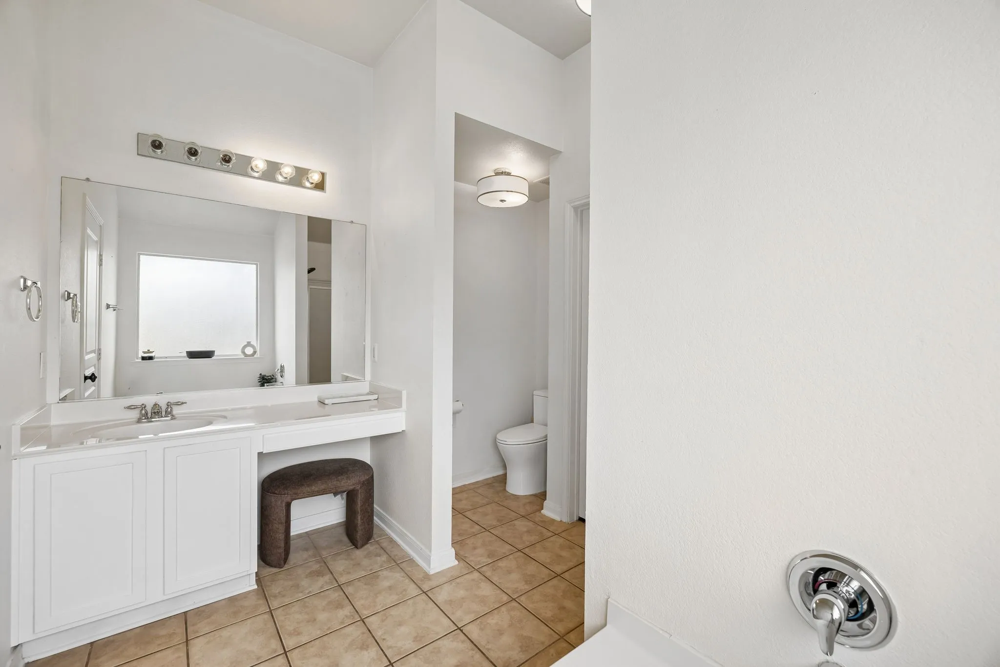Ensuite bath shared vanity has space for 2 to get ready.