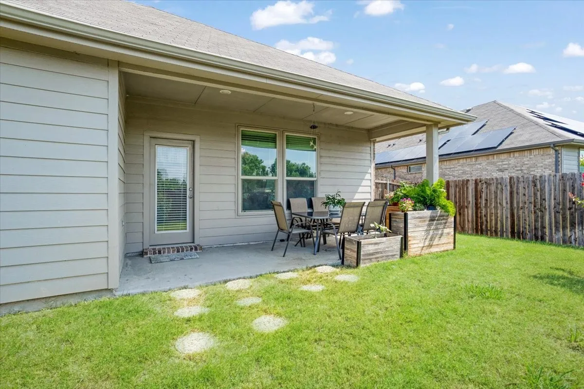 Covered patio perfect for relaxing and enjoying evenings outdoors