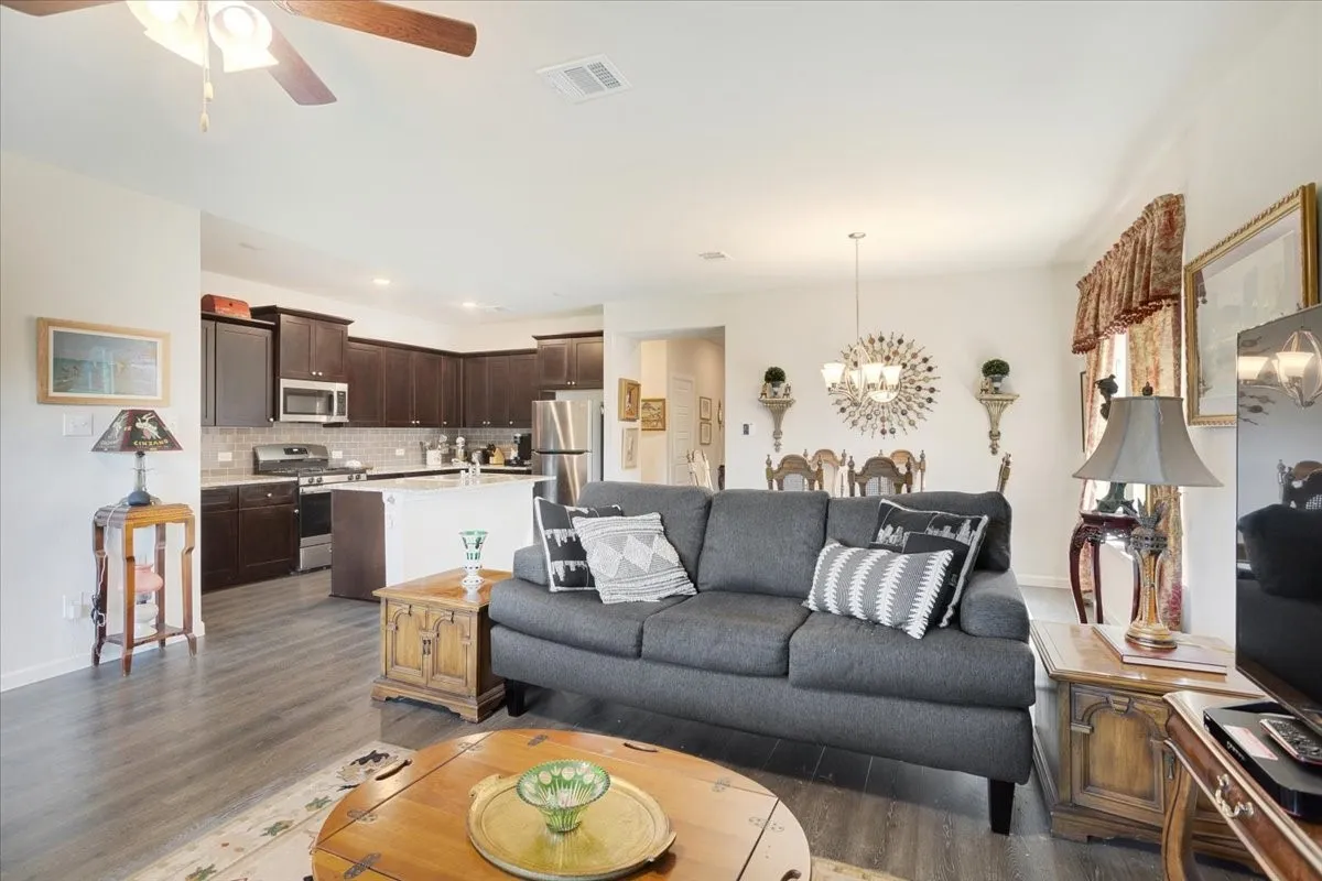 Open-concept kitchen, dining, and living areas.