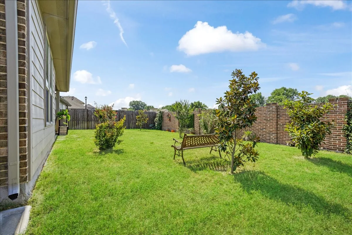 Good size backyard with Crape Myrtle and Magnolia trees