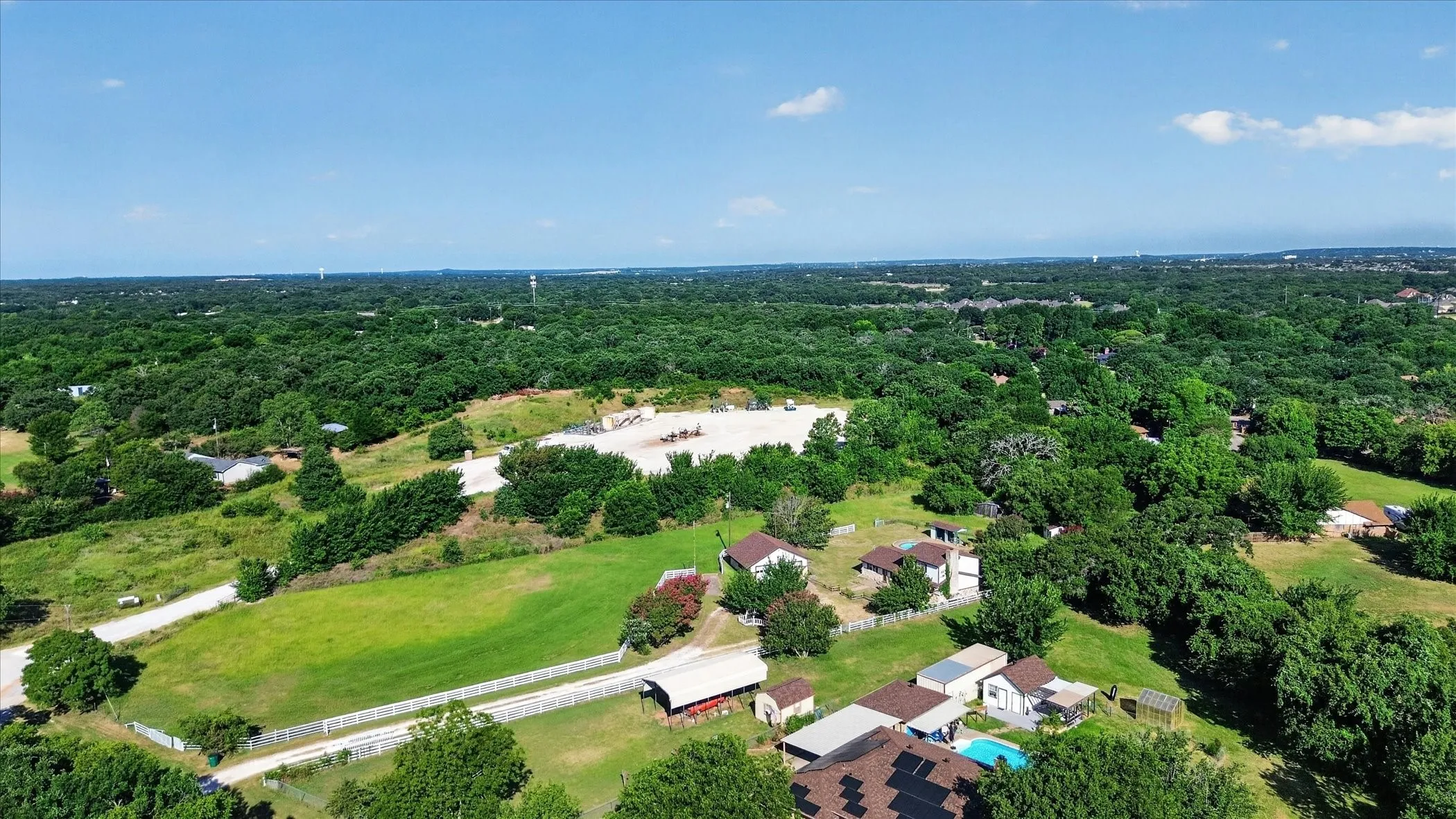 Expansive property featuring mature trees and open green spaces