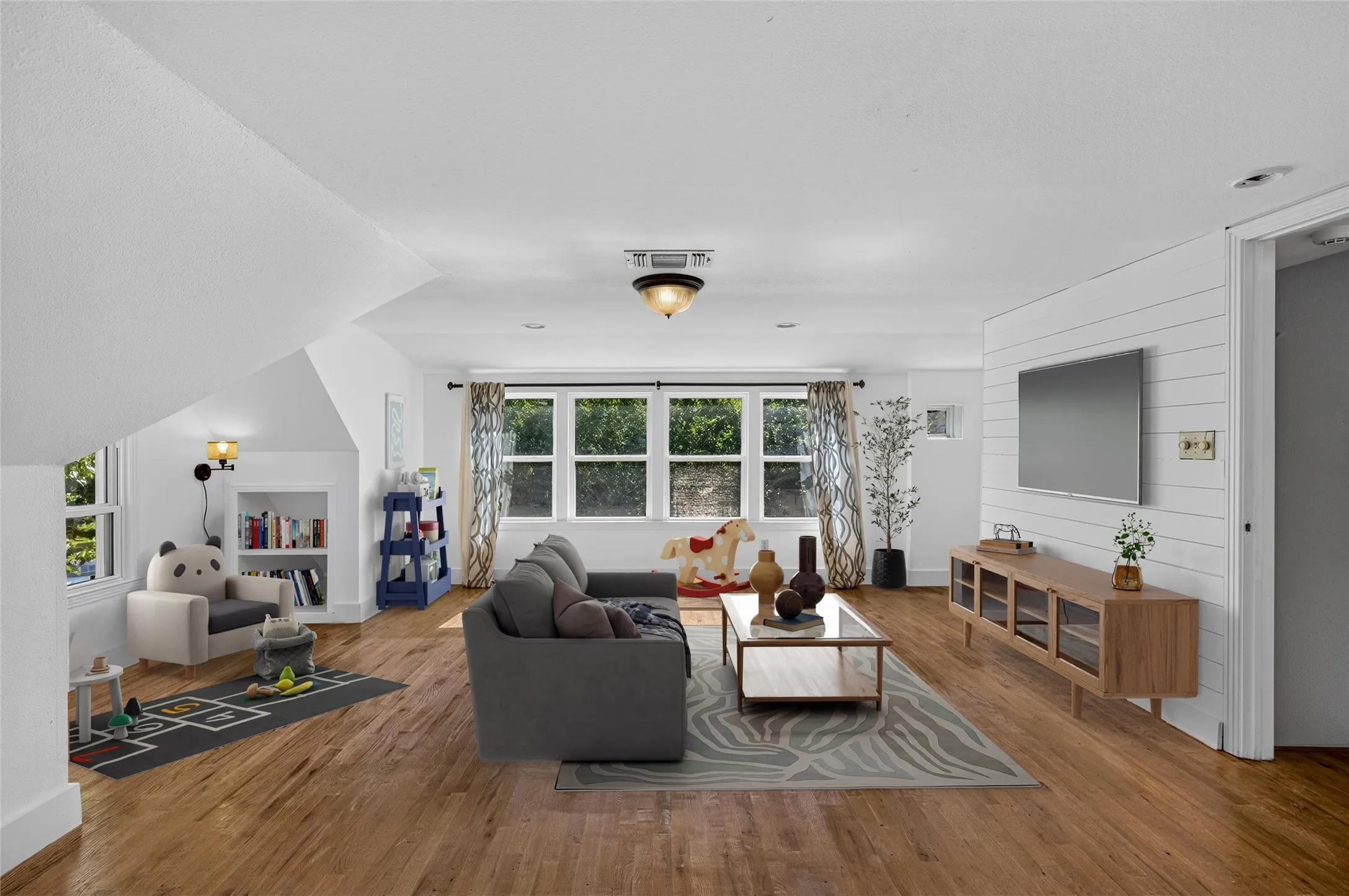 Staged to show as a media room/ game room