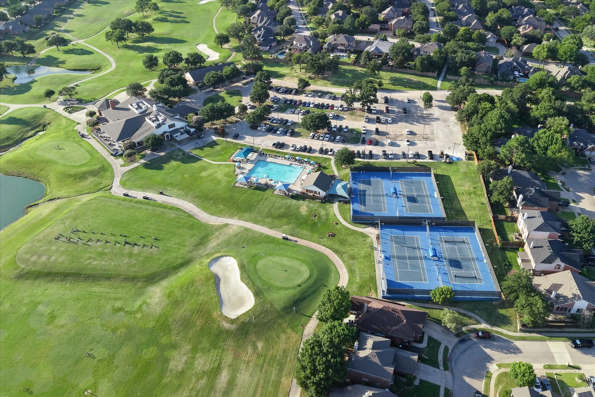 Residents enjoy access to community amenities, including a pool, clubhouse, tennis courts, and greenbelts.