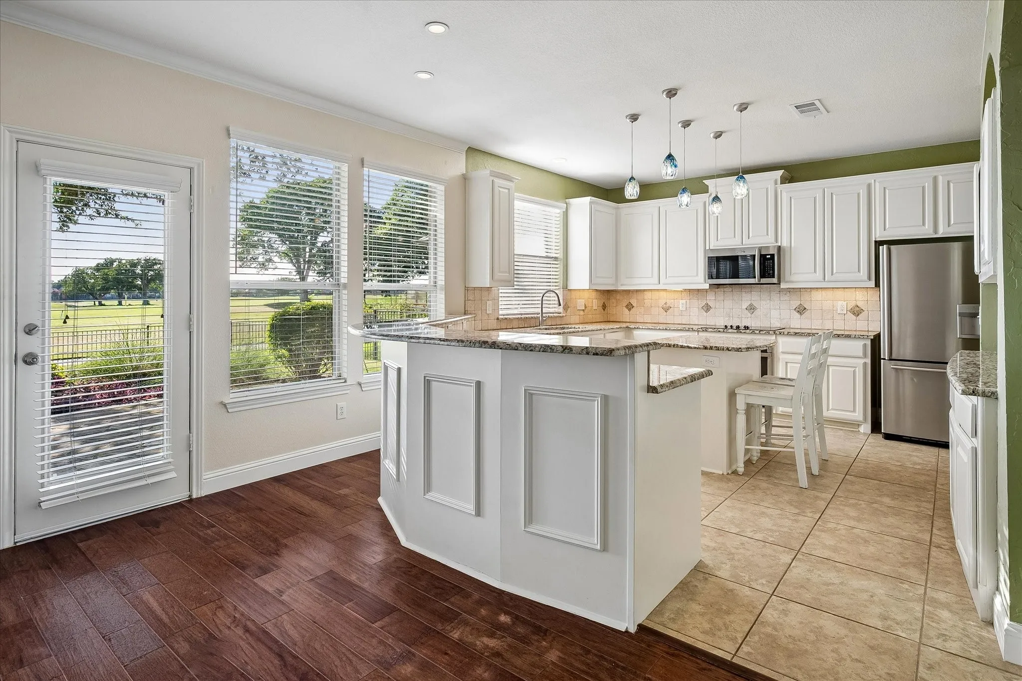 Beautifully updated kitchen featuring granite countertops