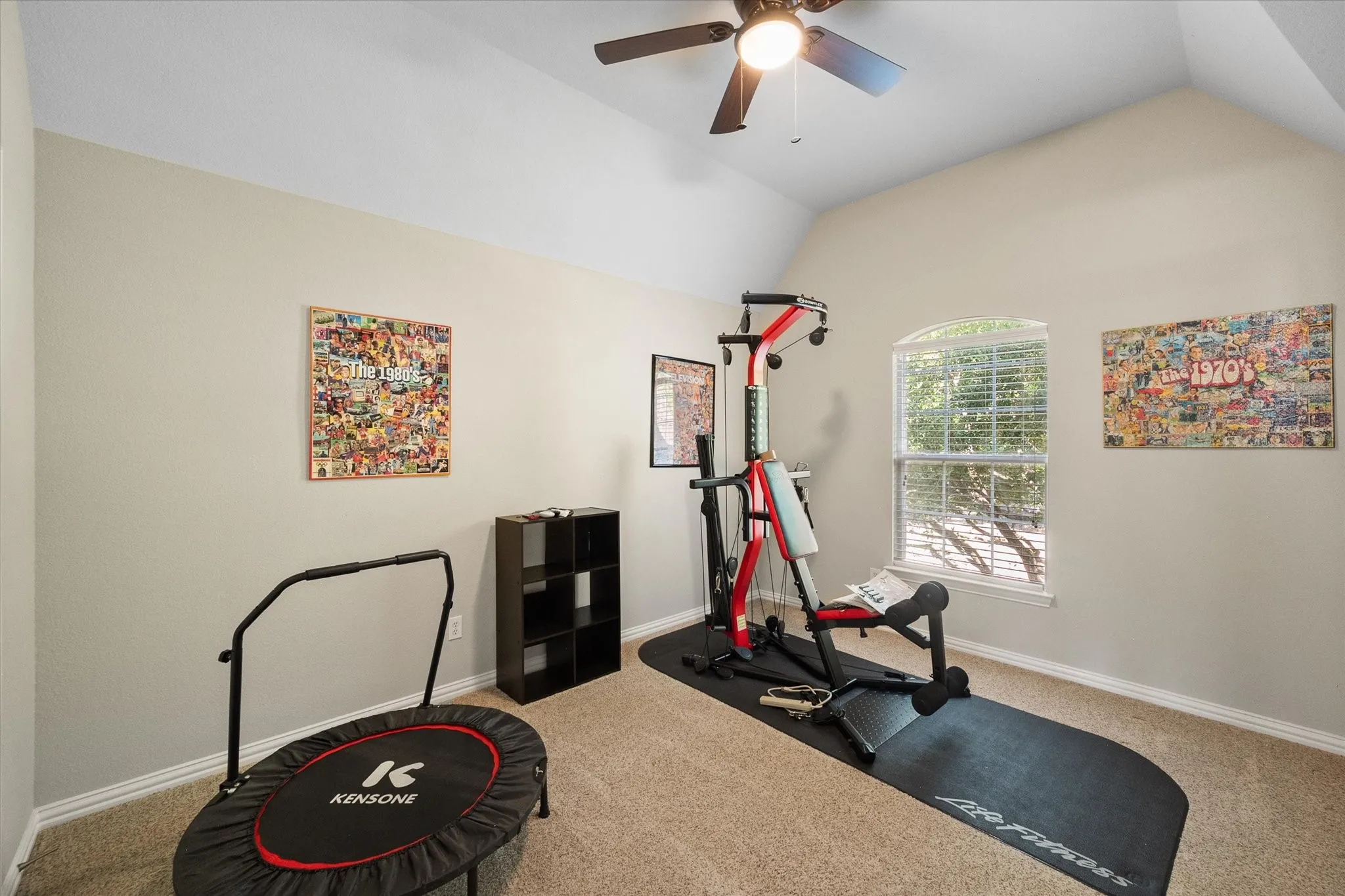 Bedroom with a ceiling fan, a window with horizontal blinds, and carpeting