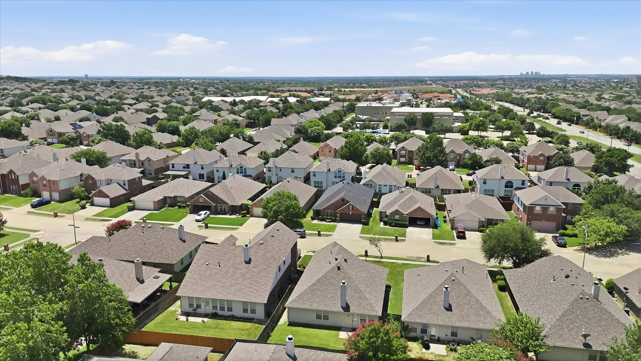 Residential neighborhood featuring a variety of single-family homes with pitched roofs and mature landscaping
