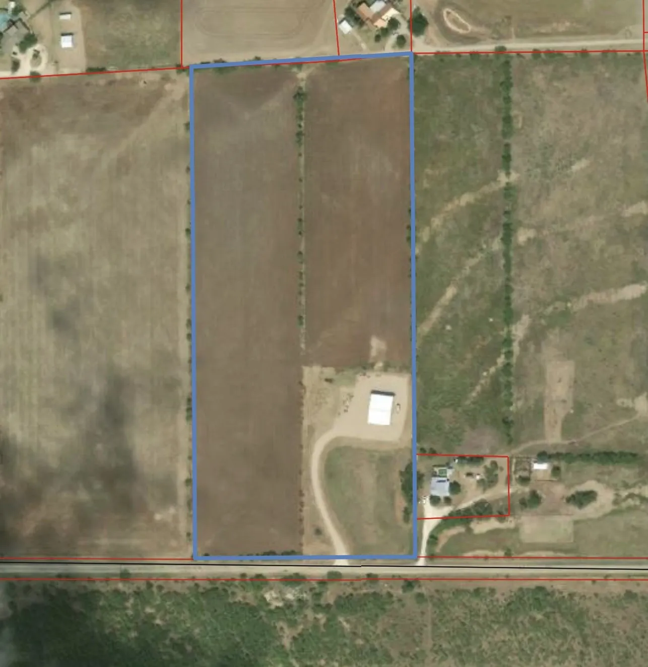 2747 CR 103N outlined in blue. 18+ acres with workshop.