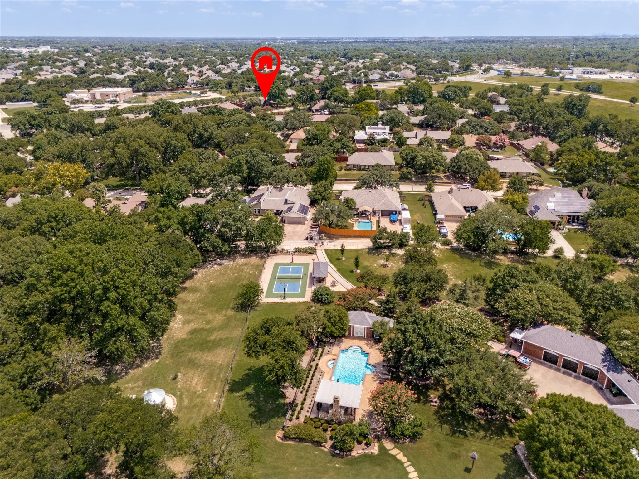 Aerial perspective showcasing expansive tree-lined properties