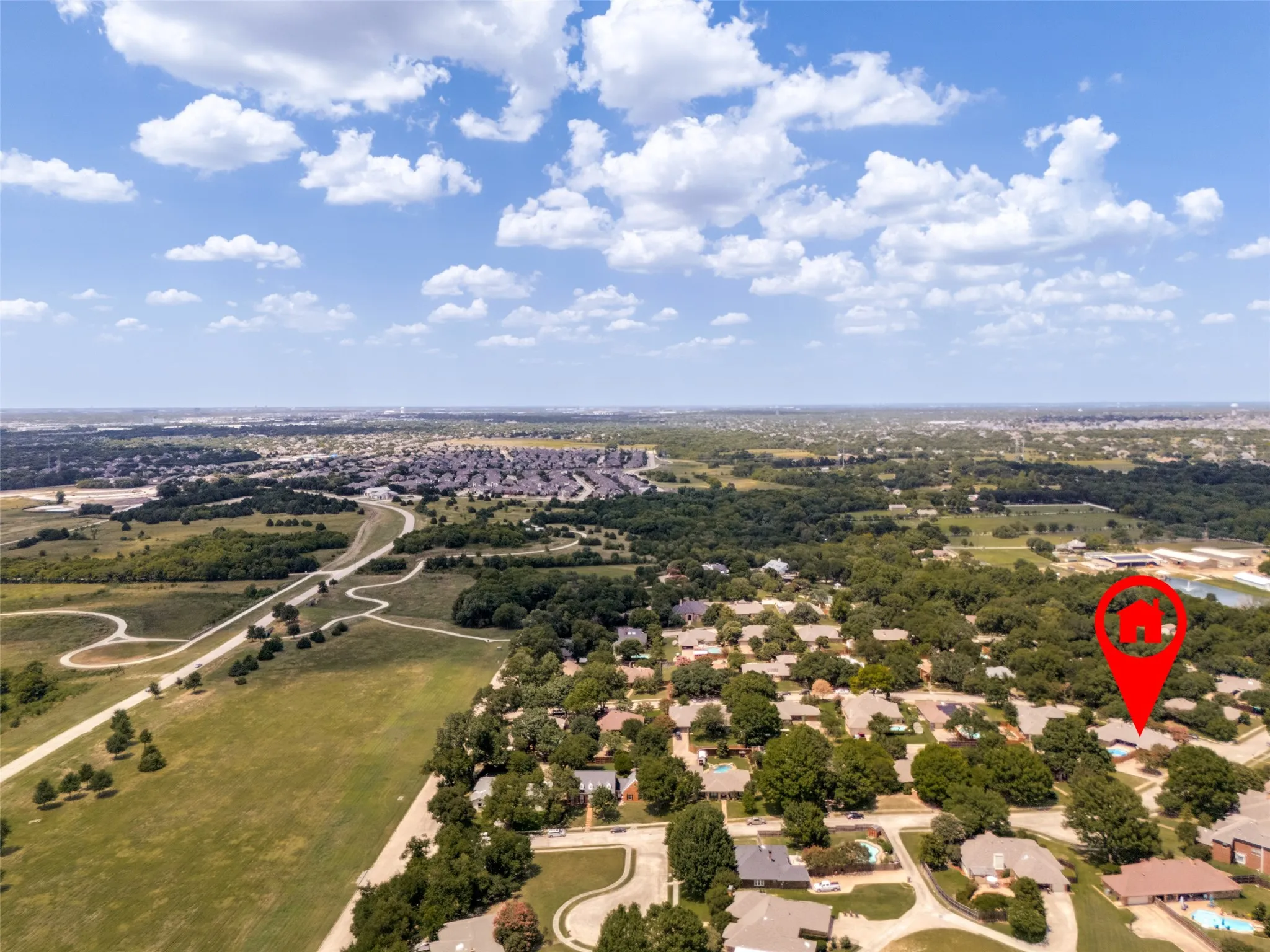 Aerial perspective showcasing a residential neighborhood close to parks, walking tails & community events