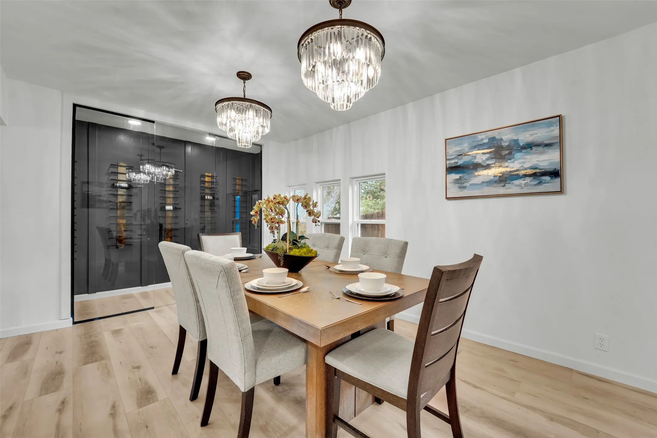 Dedicated dining area featuring light wood-finish flooring