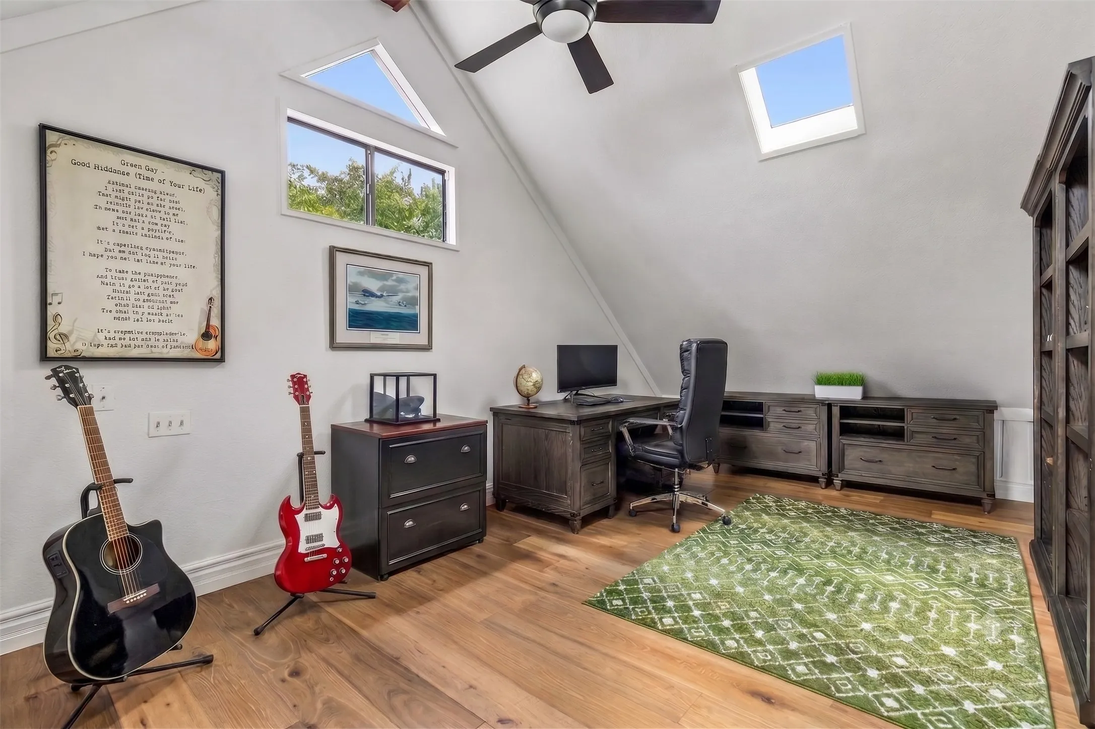 Up the spiral staircase you'll find this versatile room perfect for an office, studio, or learning room.