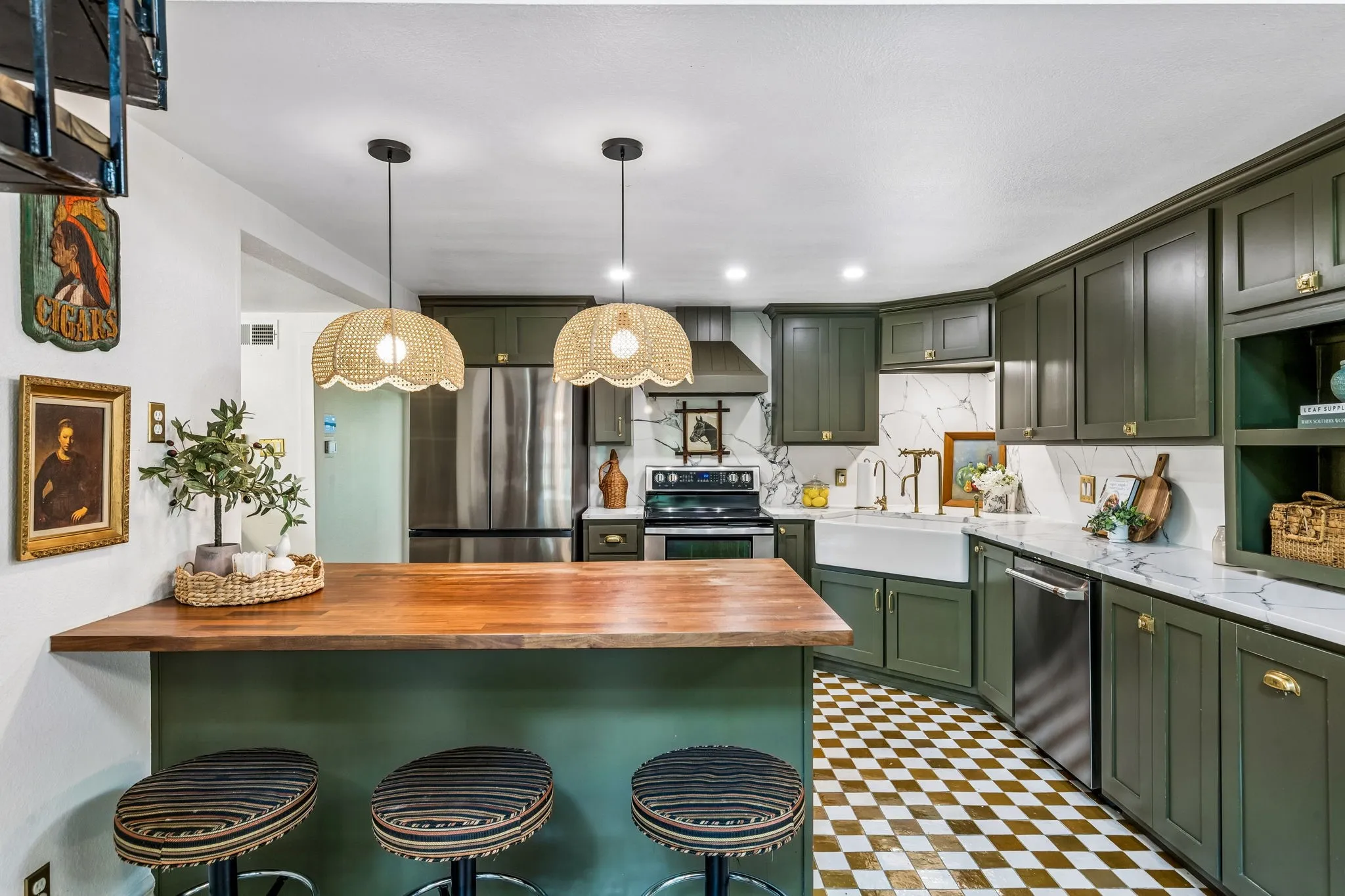 Fully updated kitchen with custom cabinets, quartz counters, zellige tile floors, high end hardware, farmhouse sink, and new appliances