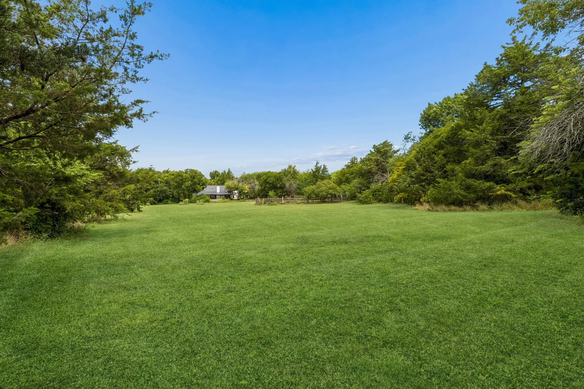 Two acres of open pasture for sports, family gatherings, or room for pets and kids to roam.